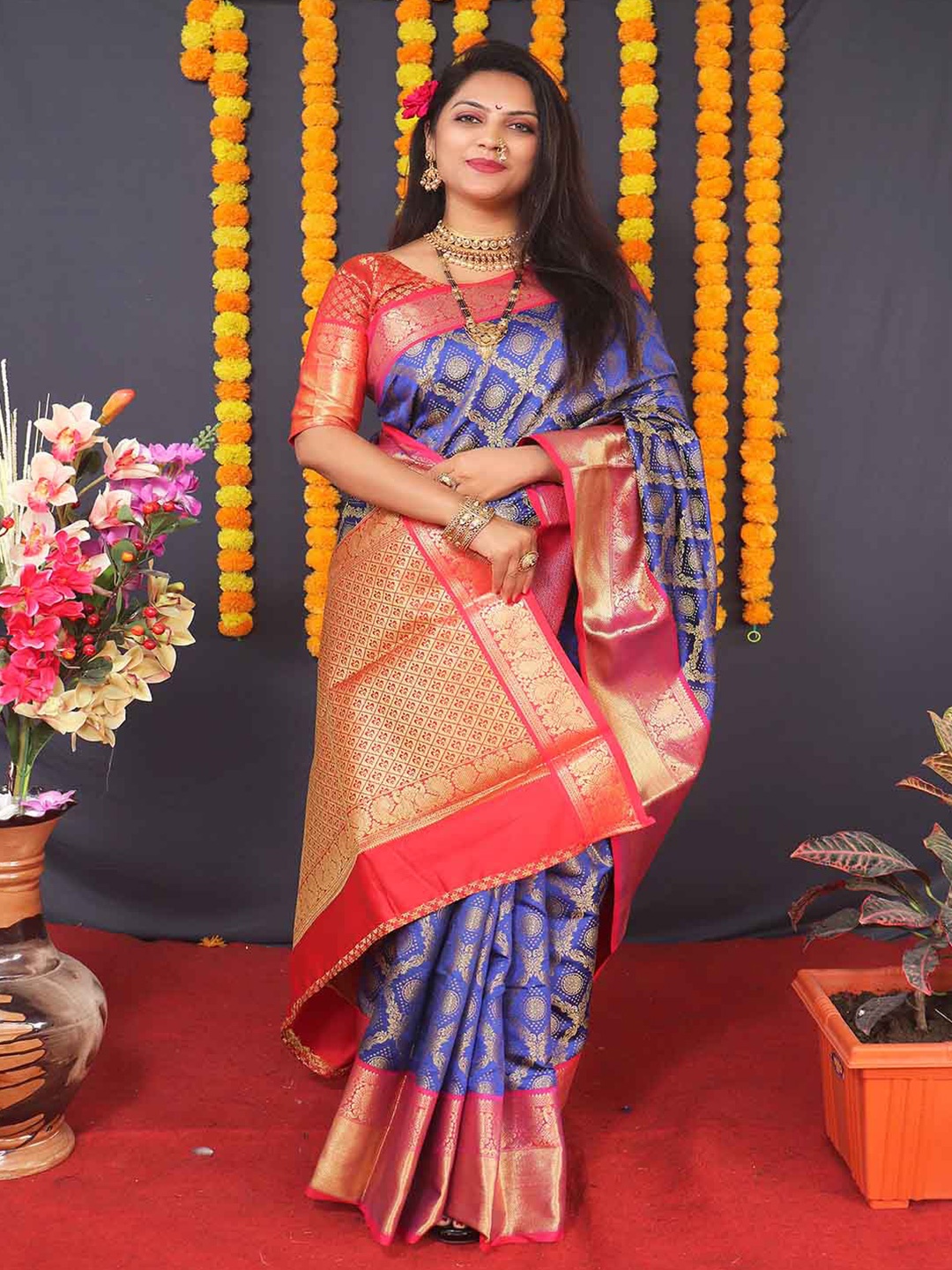 

Mitera Blue & Red Ethnic Motifs Woven Design Zari Art Silk Saree