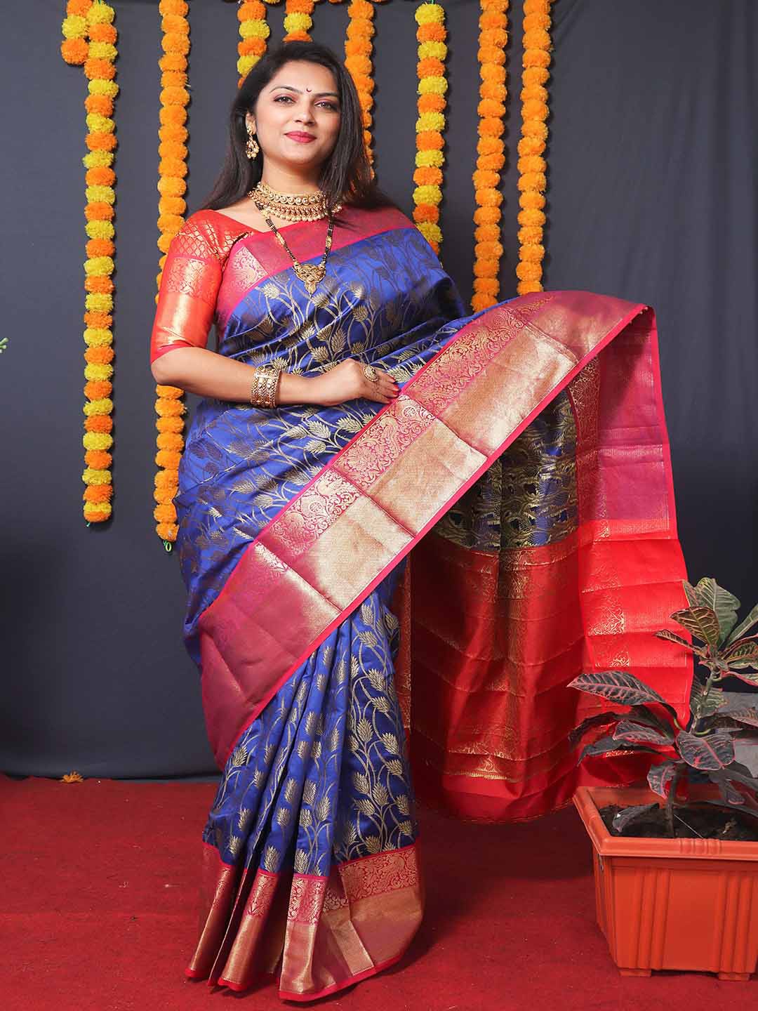 

Mitera Blue & Red Floral Woven Design Zari Art Silk Saree