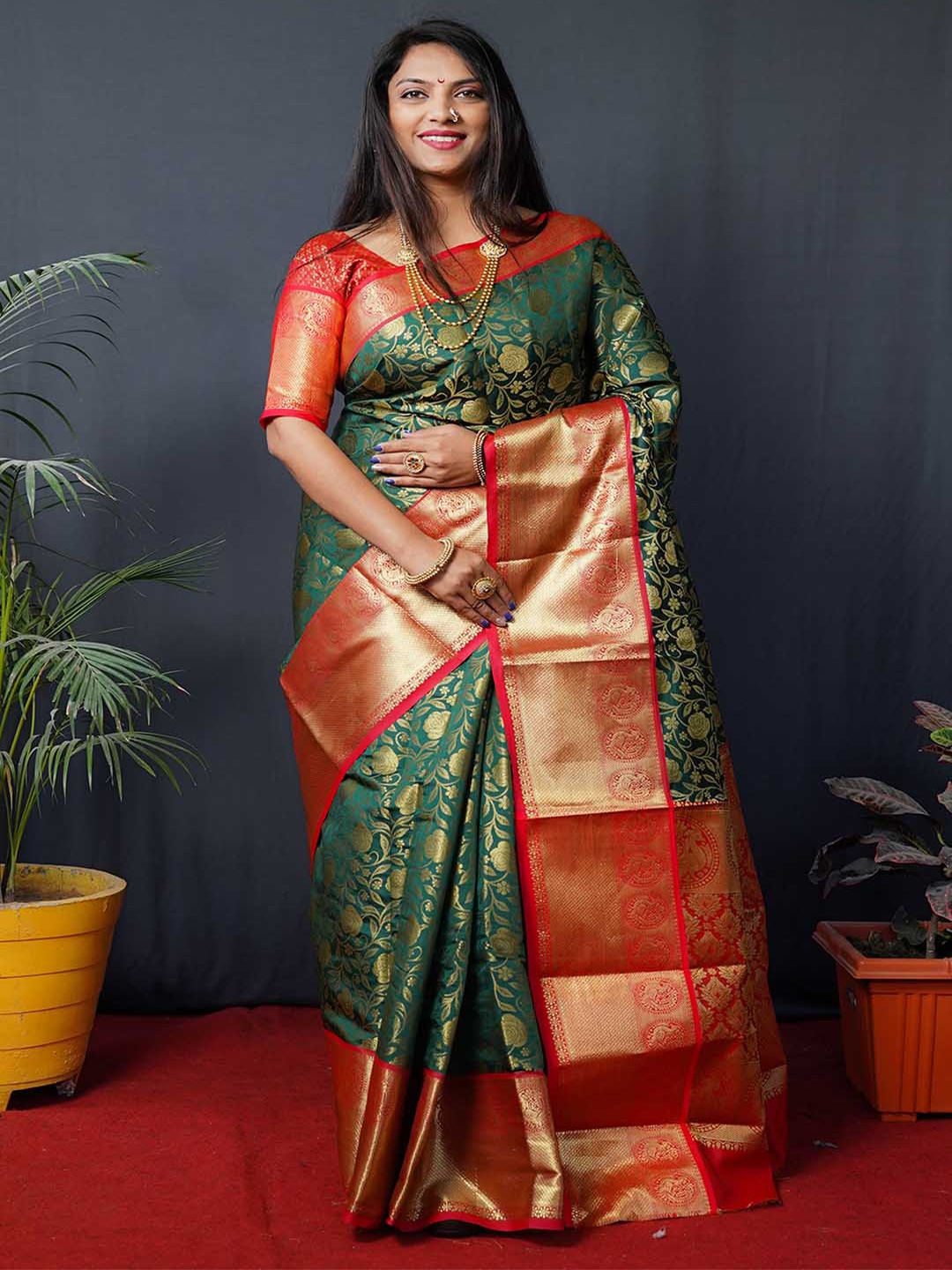 

Mitera Green & Red Ethnic Motifs Woven Design Zari Kanchipuram Pure Silk Saree