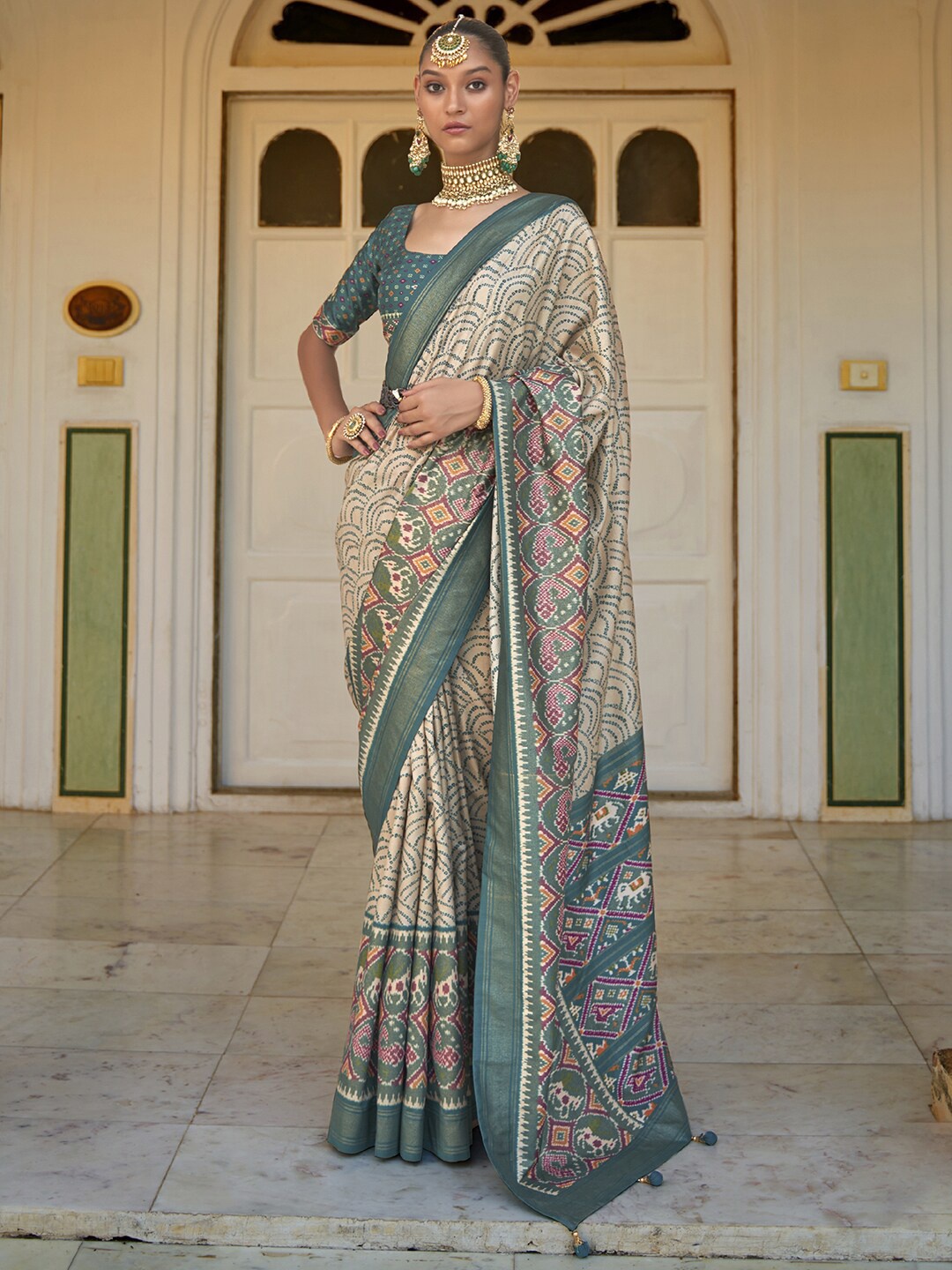 

Anouk Cream & Green Ethnic Motifs Printed Zari Patola Saree
