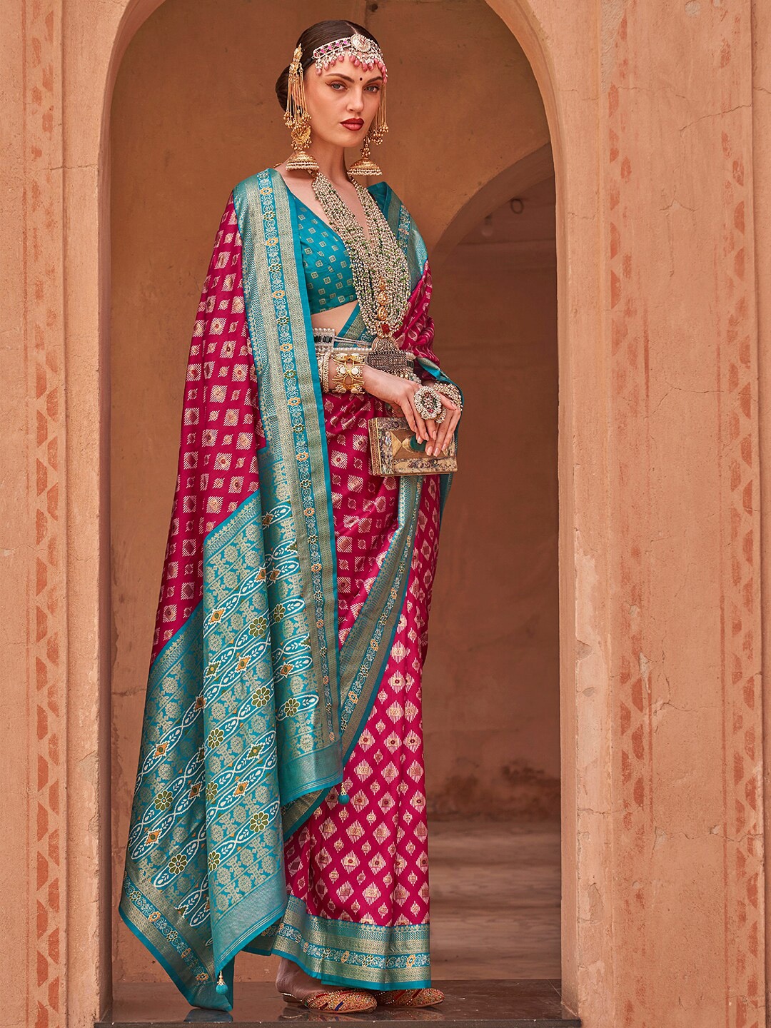 

Anouk Pink & Blue Ethnic Motifs Woven Design Zari Banarasi Saree