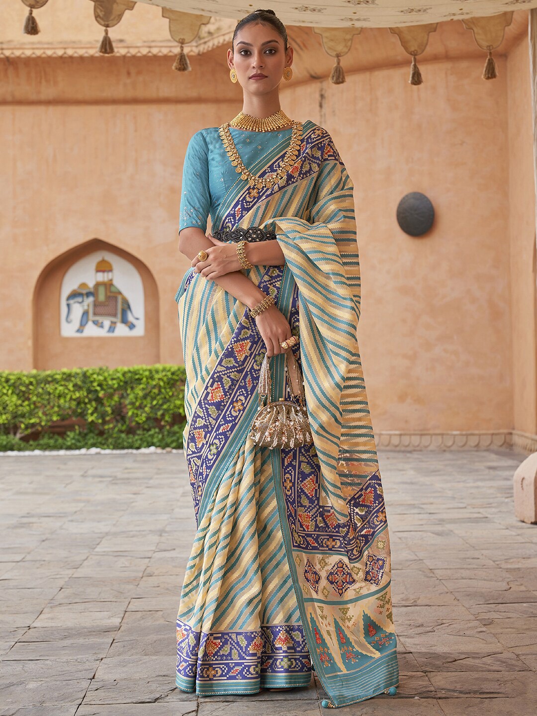 

Anouk Cream & Blue Leheriya Printed Zari Organza Banarasi Saree