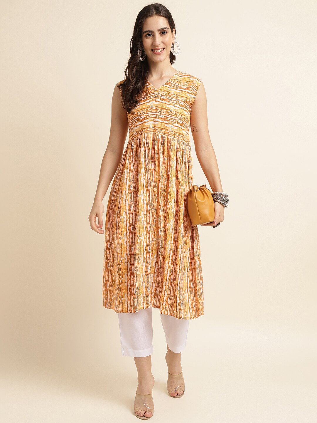 

Fabclub Abstract Printed A-Line Pleated Kurta with Trousers, Mustard