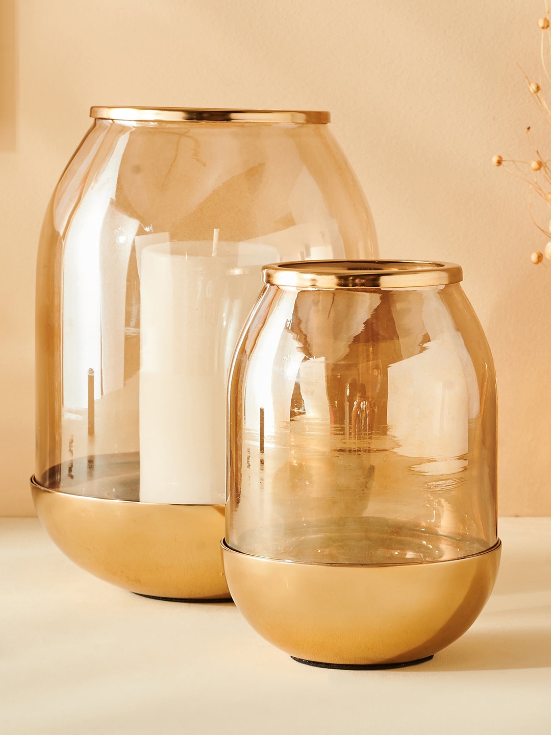 

Home Centre Gold Toned & Transparent Hurricane Candle Holder