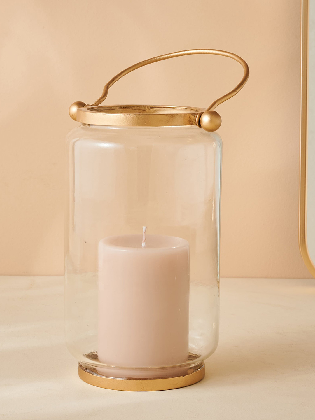 

Home Centre Raga Golden & Transparent Glass Hanging Lantern, Gold