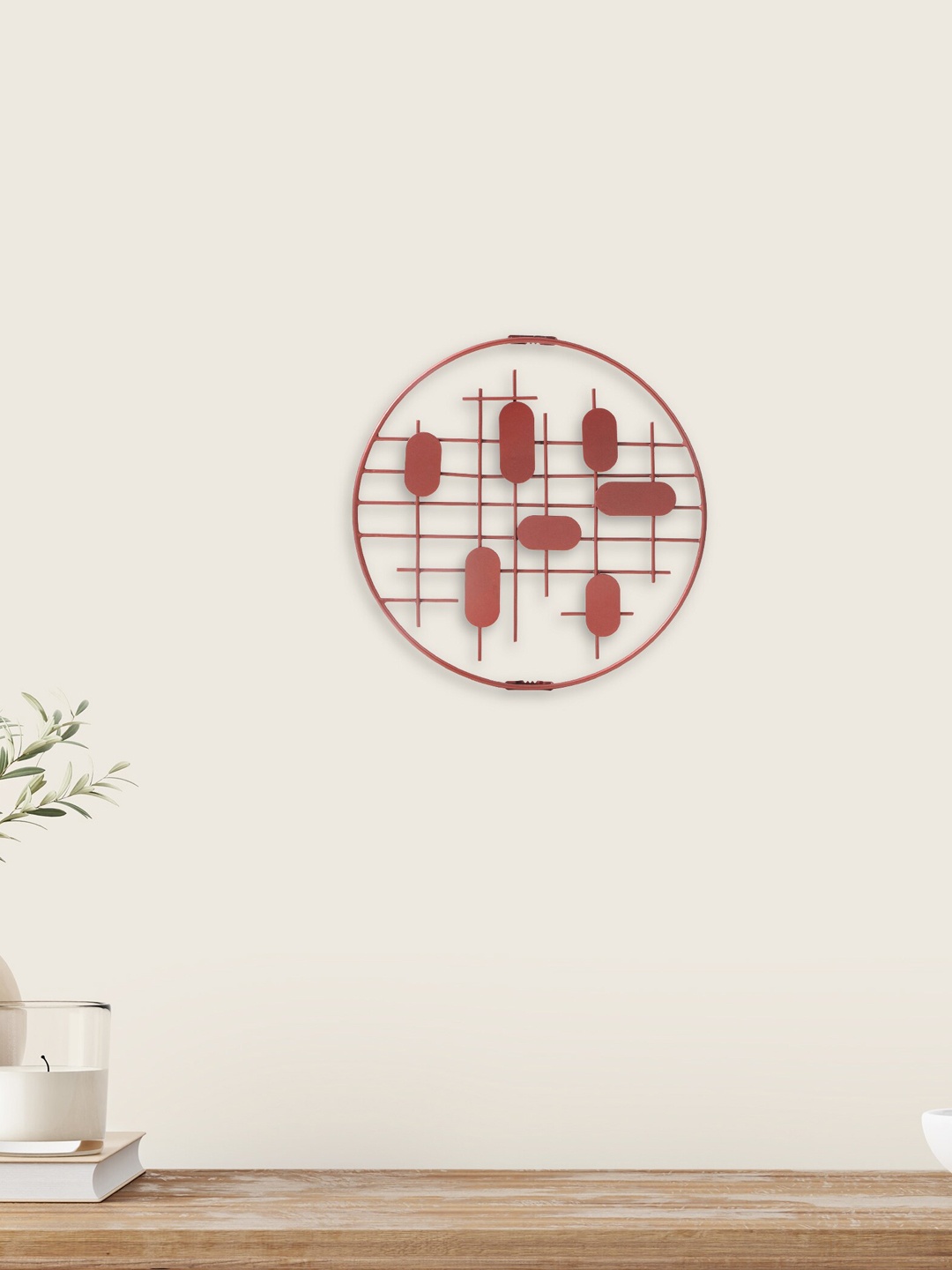 

Home Centre Pacific Iliano Peach Colored Abstract Metal Round Wall Art