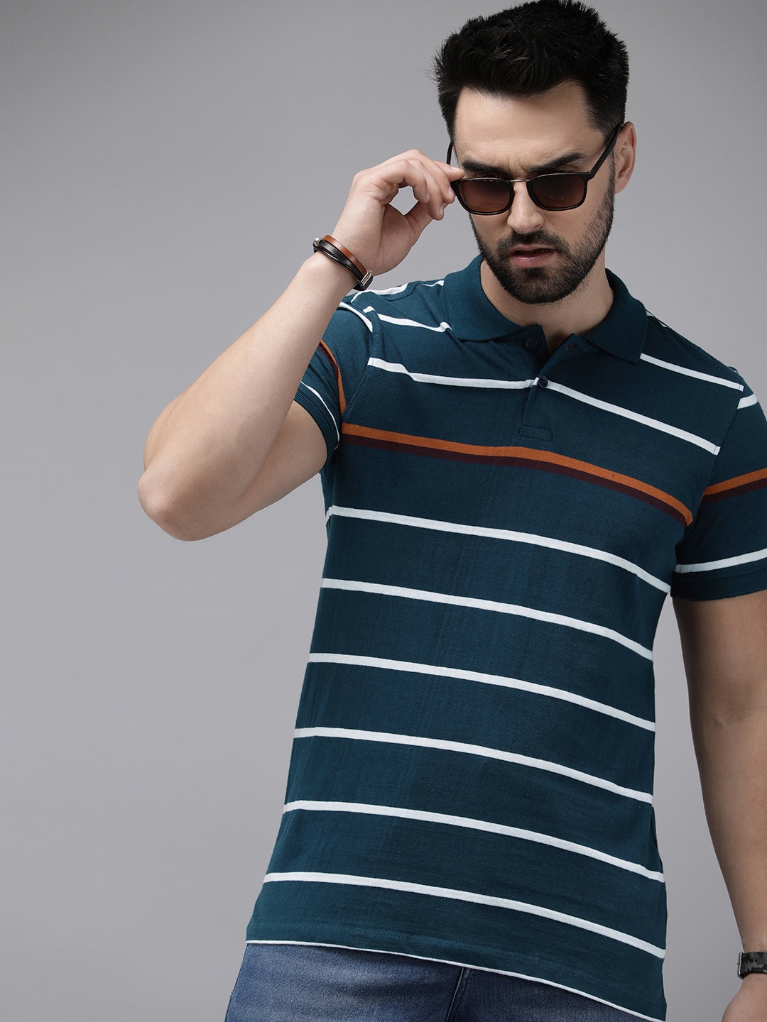 

Roadster Men Striped Polo Collar T-shirt, Navy blue