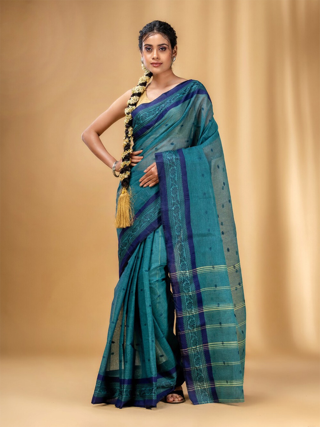 

Charukriti Abstract Woven Design Pure Cotton Taant Saree, Teal