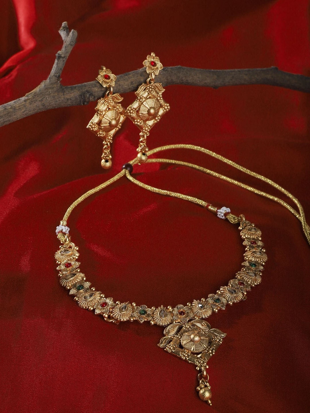 

The Pari Gold-Plated Stone Studded & Pearls Studded Jewellery Set