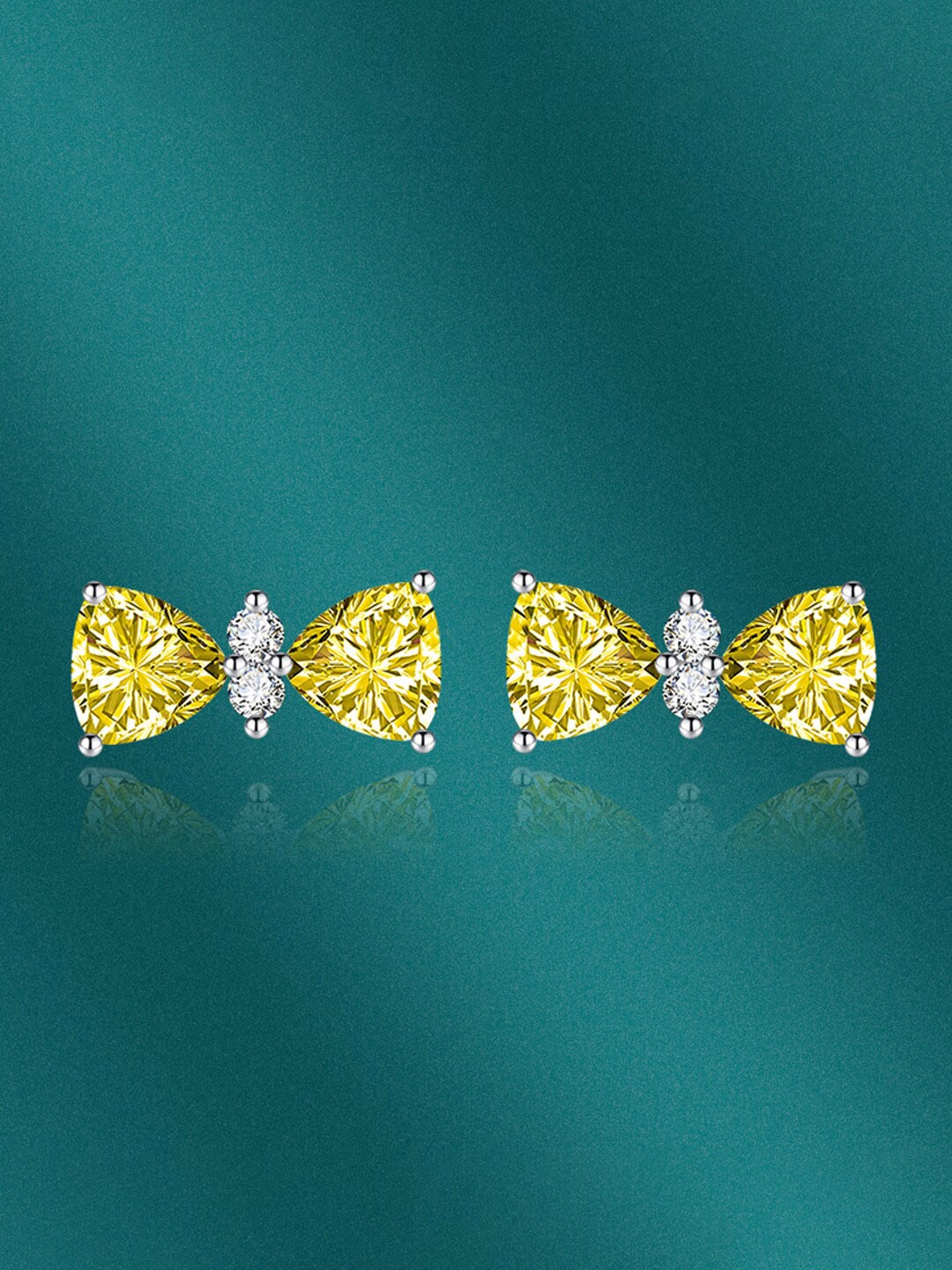 

Designs & You Silver-Plated CZ-Studded Bow Shaped Stud Earrings