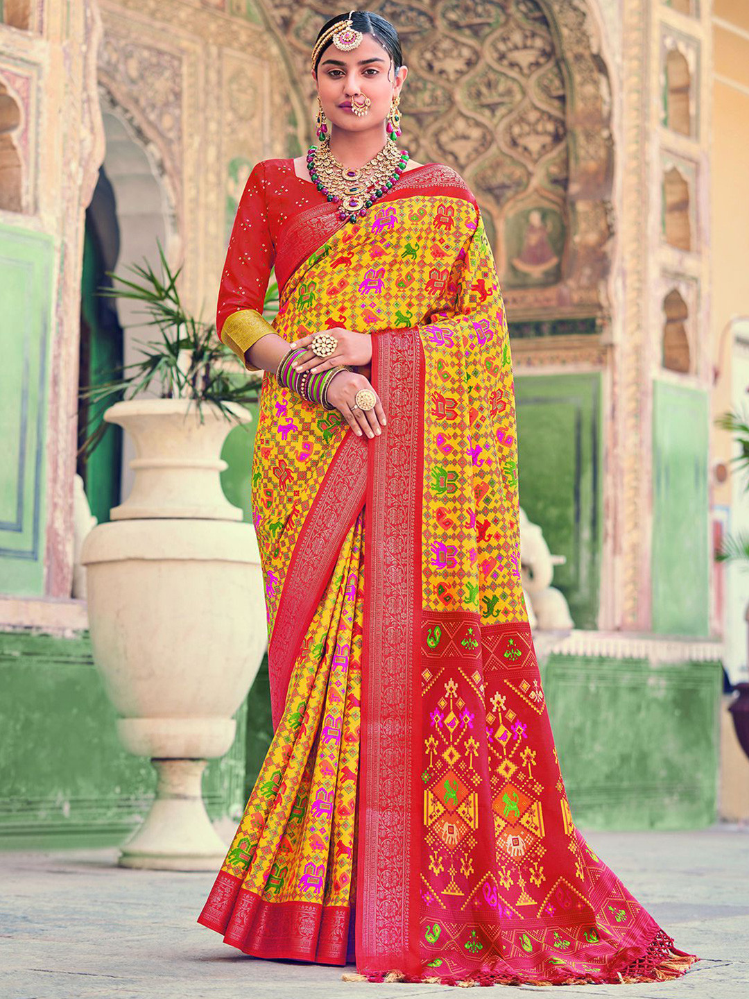 

Mitera Ethnic Motif Printed Zari Patola Saree, Yellow