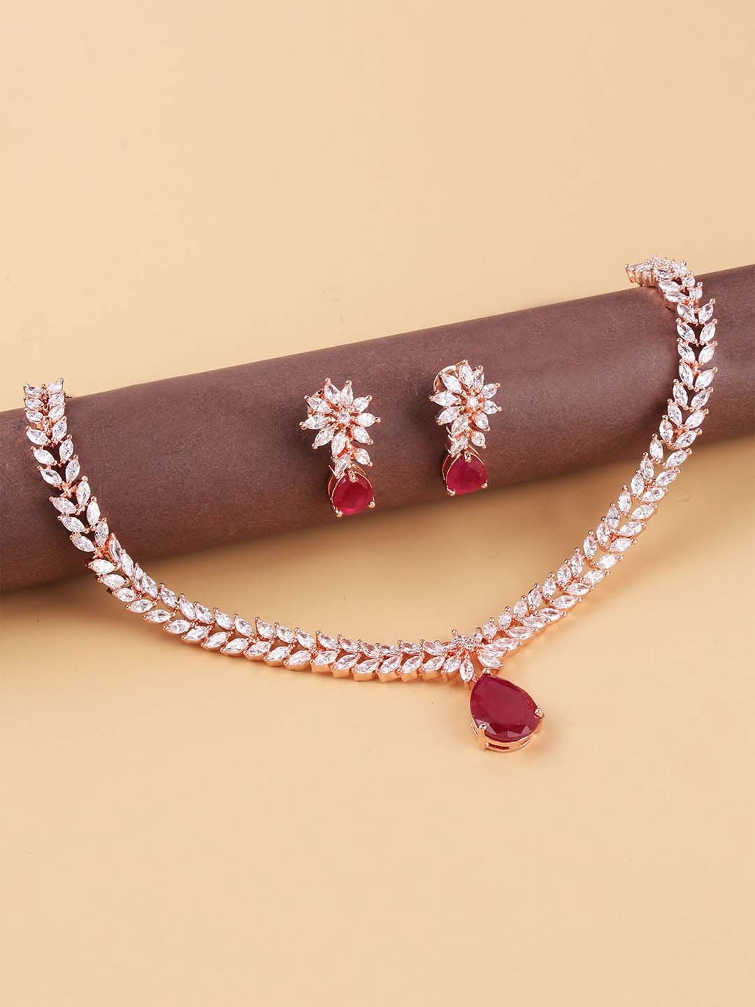 

Mirana Rose Gold-Plated Studded Diana Ruby Coloured V-Line Necklace With Earrings