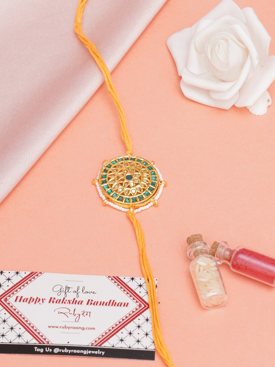 

Ruby Raang Stone-Studded Rakhi With Roli Chawal & Greeting Card Gift Box, Yellow