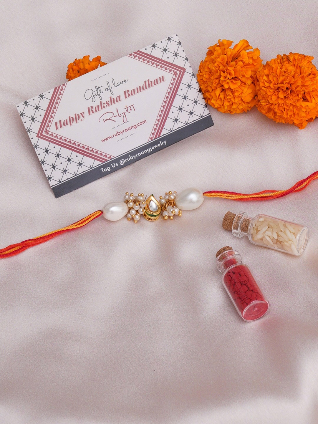 

Ruby Raang Stone-Studded & Beaded Rakhi With Roli Chawal & Greeting Card Gift Box, White