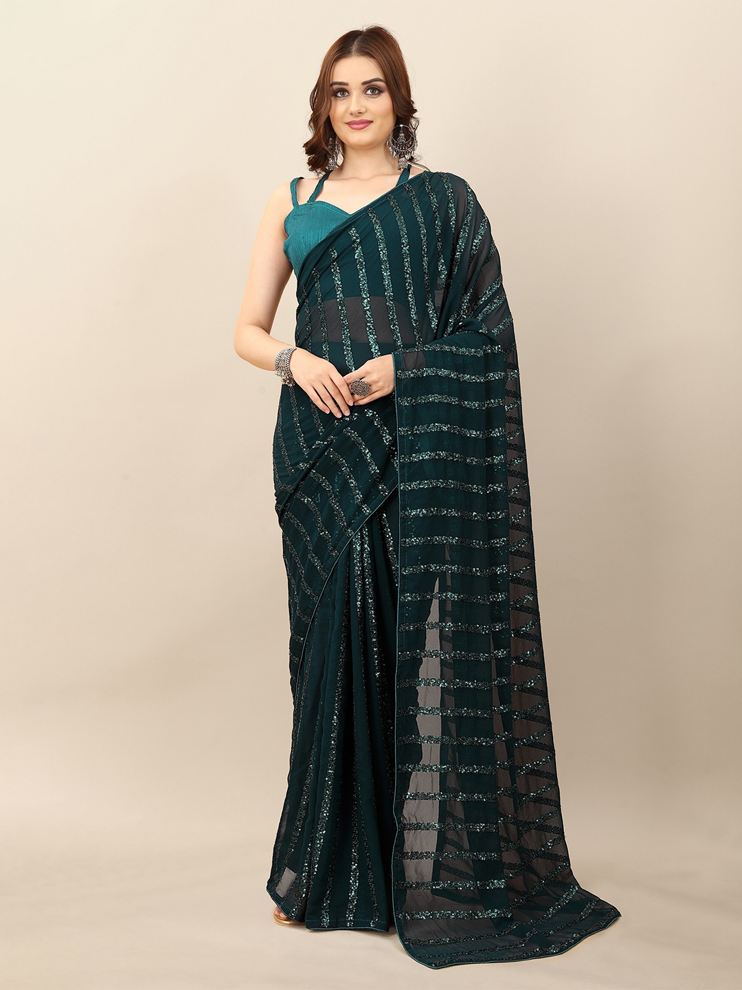 

Mitera Green Embellished Sequinned Pure Georgette Saree