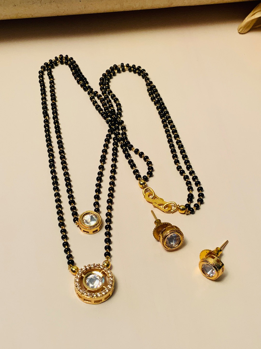 

ABDESIGNS Gold Plated Stone-Studded & Beaded Mangalsutra With Earrings