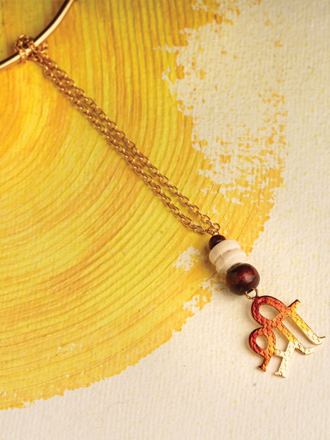 

Suhani Pittie Men 22KT Gold Plated & Shri Charm Lumba Rakhi