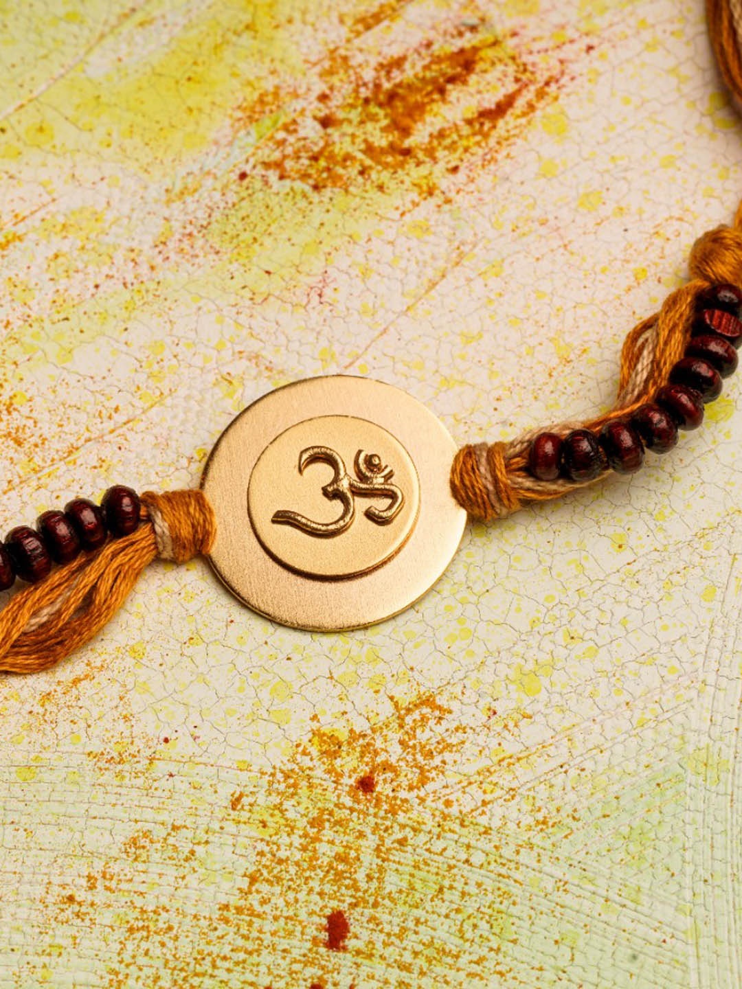 

Suhani Pittie Men 22KT Gold Plated & Om Charm Rakhi