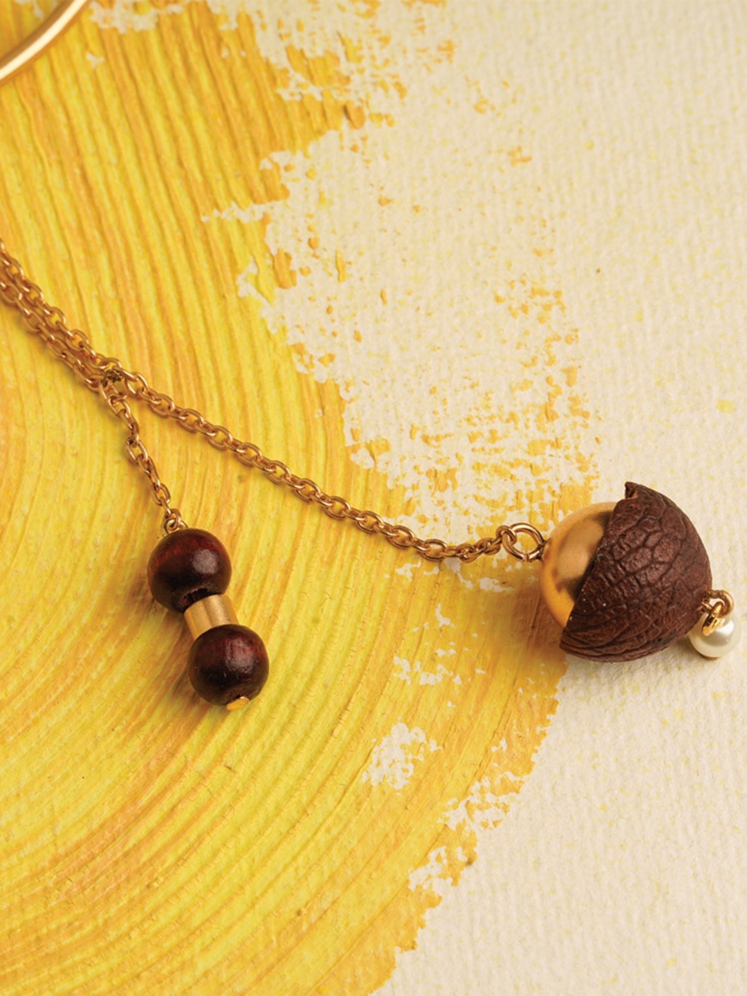 

Suhani Pittie Women 22k Gold Plated Betel Nut Charm Lumba Rakhi