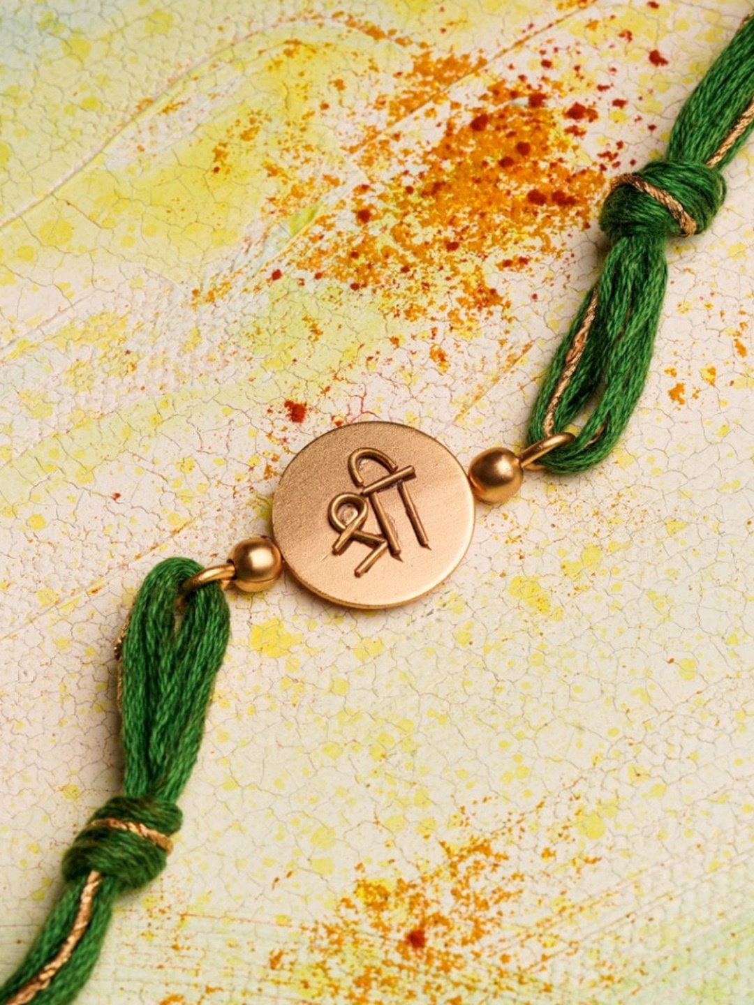 

Suhani Pittie 22KT Gold Plated Shree Charm Thread Rakhi