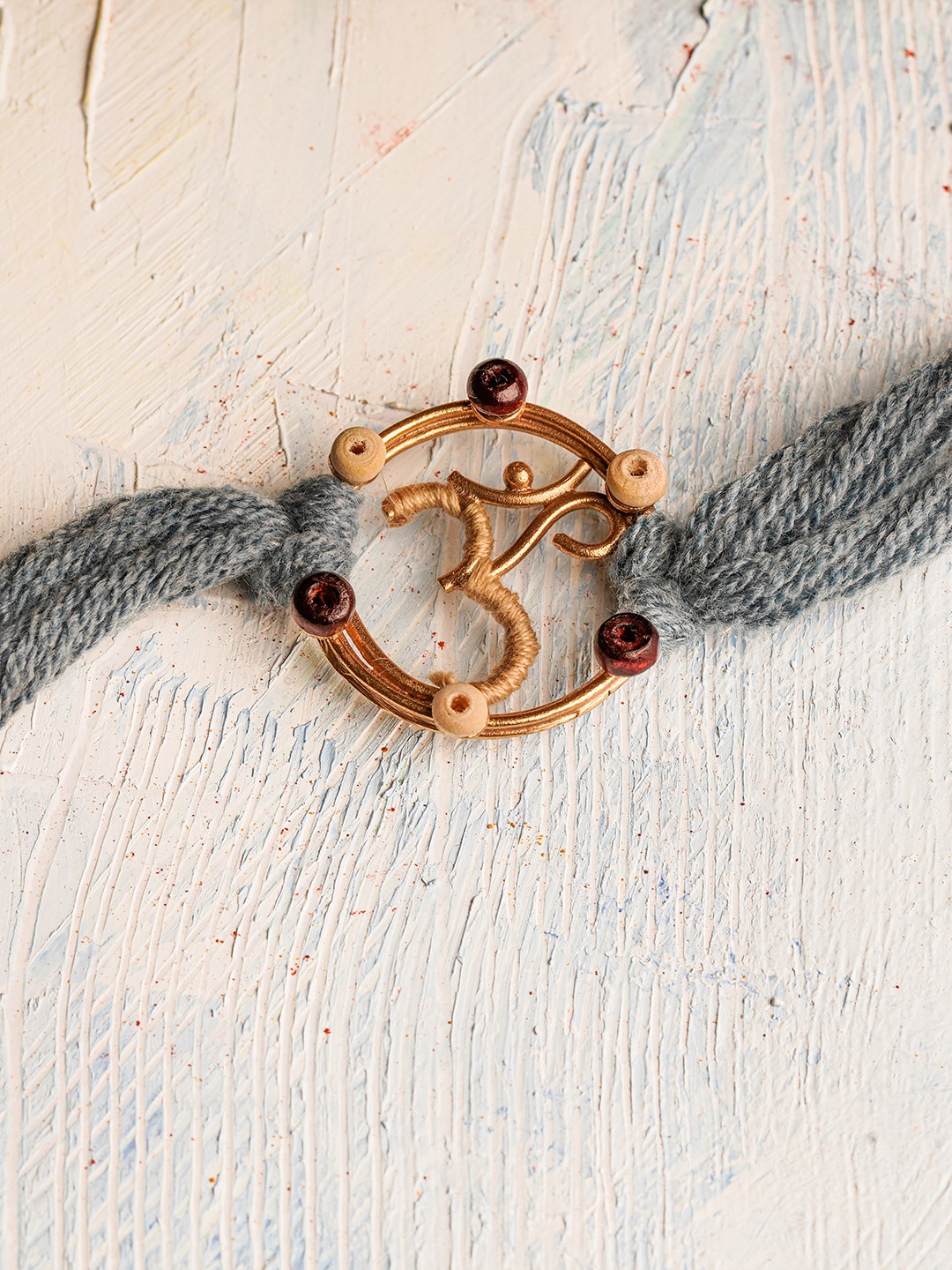 

Suhani Pittie 22K Gold Plated & Om Charm Rakhi