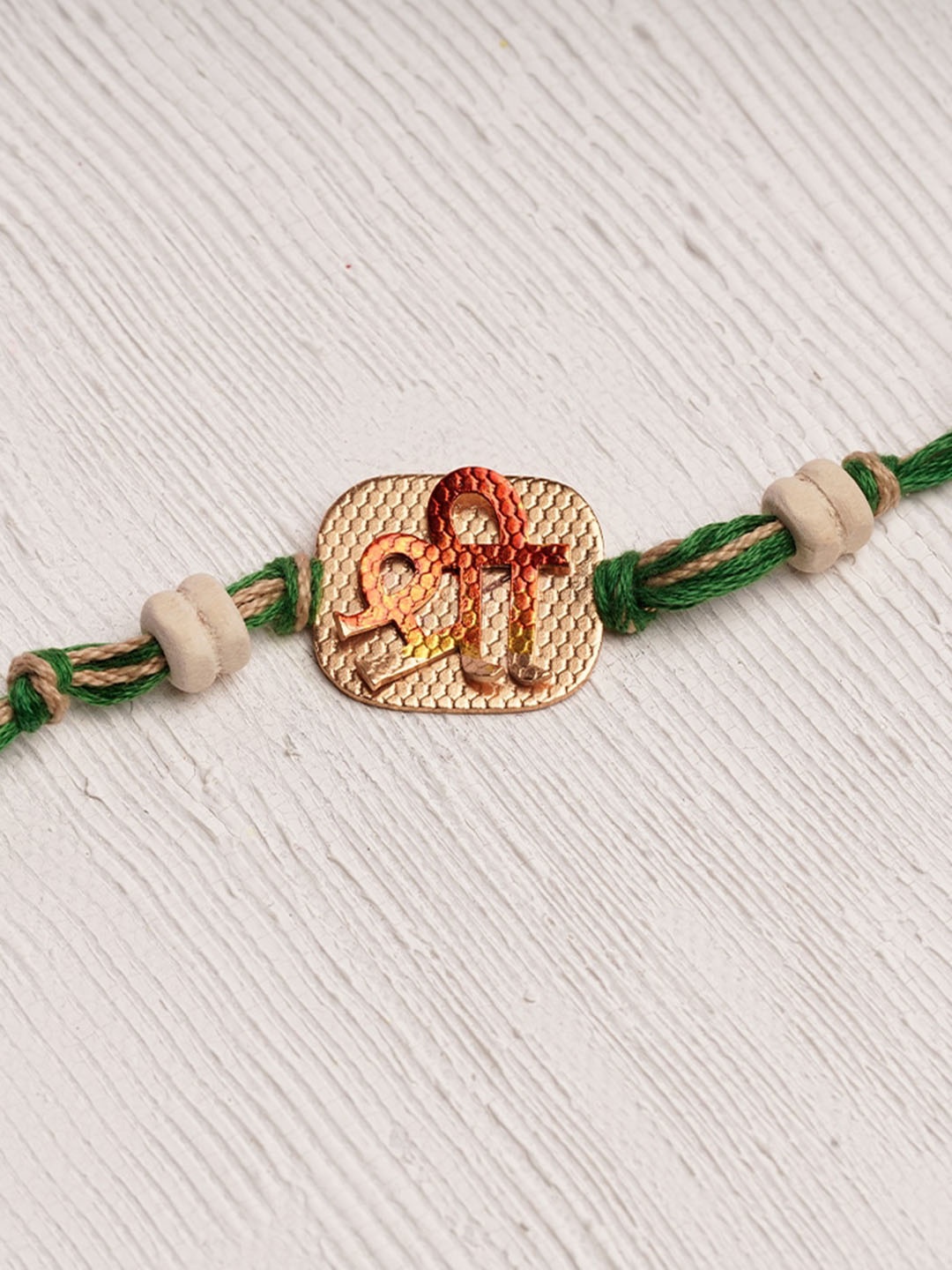 

Suhani Pittie 22KT Gold-Plated Swastika Charm Thread Rakhi