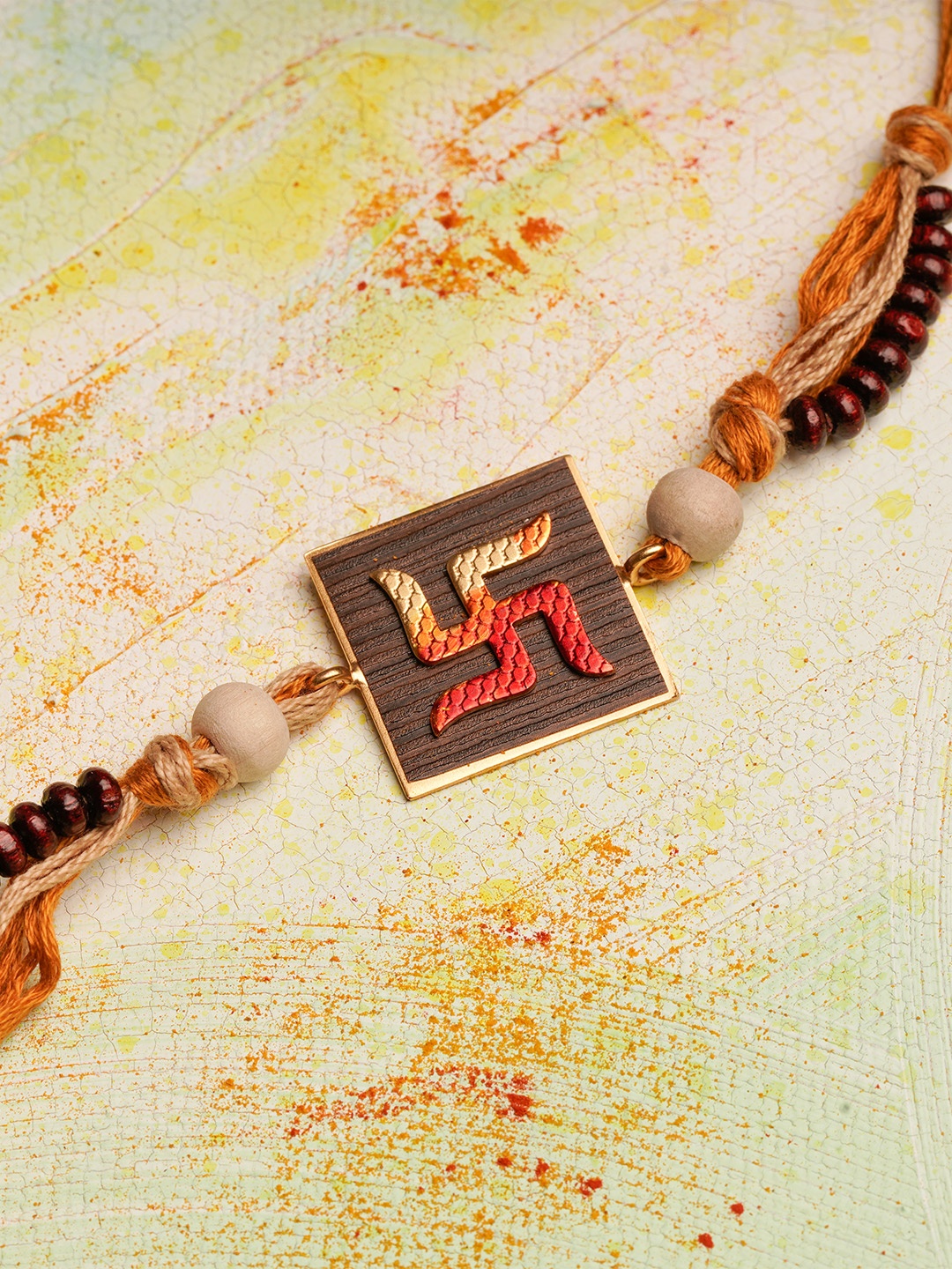 

Suhani Pittie 22K Gold-Plated Swastika Charm Rakhi