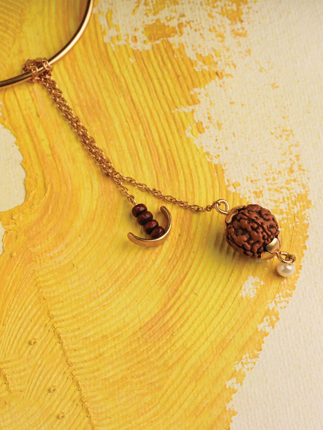

Suhani Pittie Women 22KT Gold Plated Rudraksh Charm Lumba Rakhi