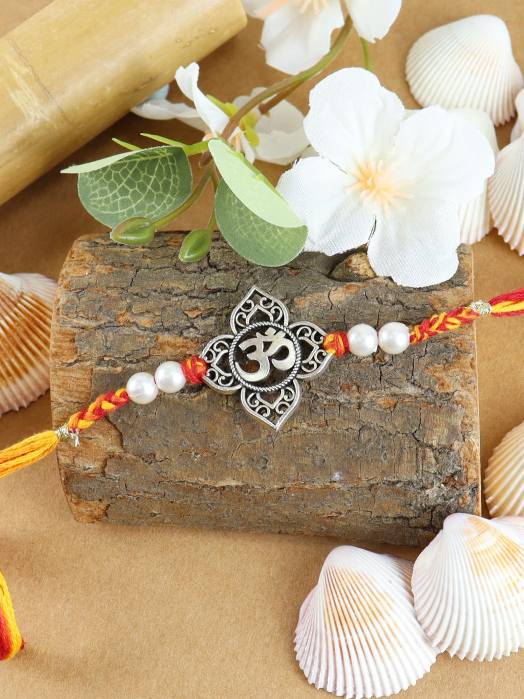 

Asthetika Men Om Charm Rakhi, Red
