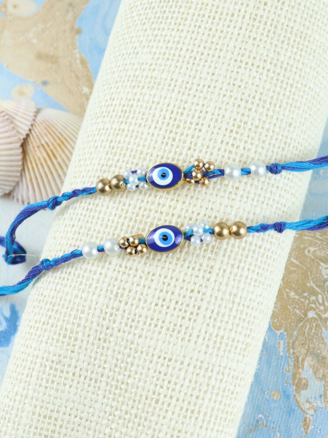 

Asthetika Men Set Of 2 Evil Eye Stone Studded Rakhi, Blue