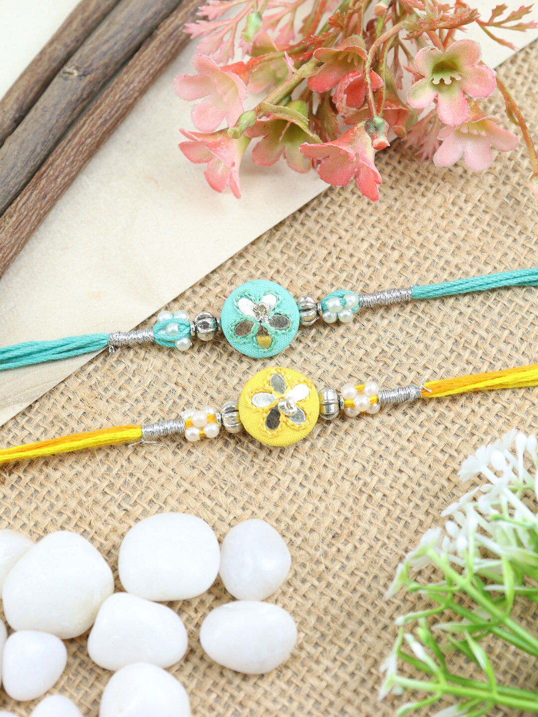 

Asthetika Set Of 2 Embroidered Buttis Rakhi, Yellow