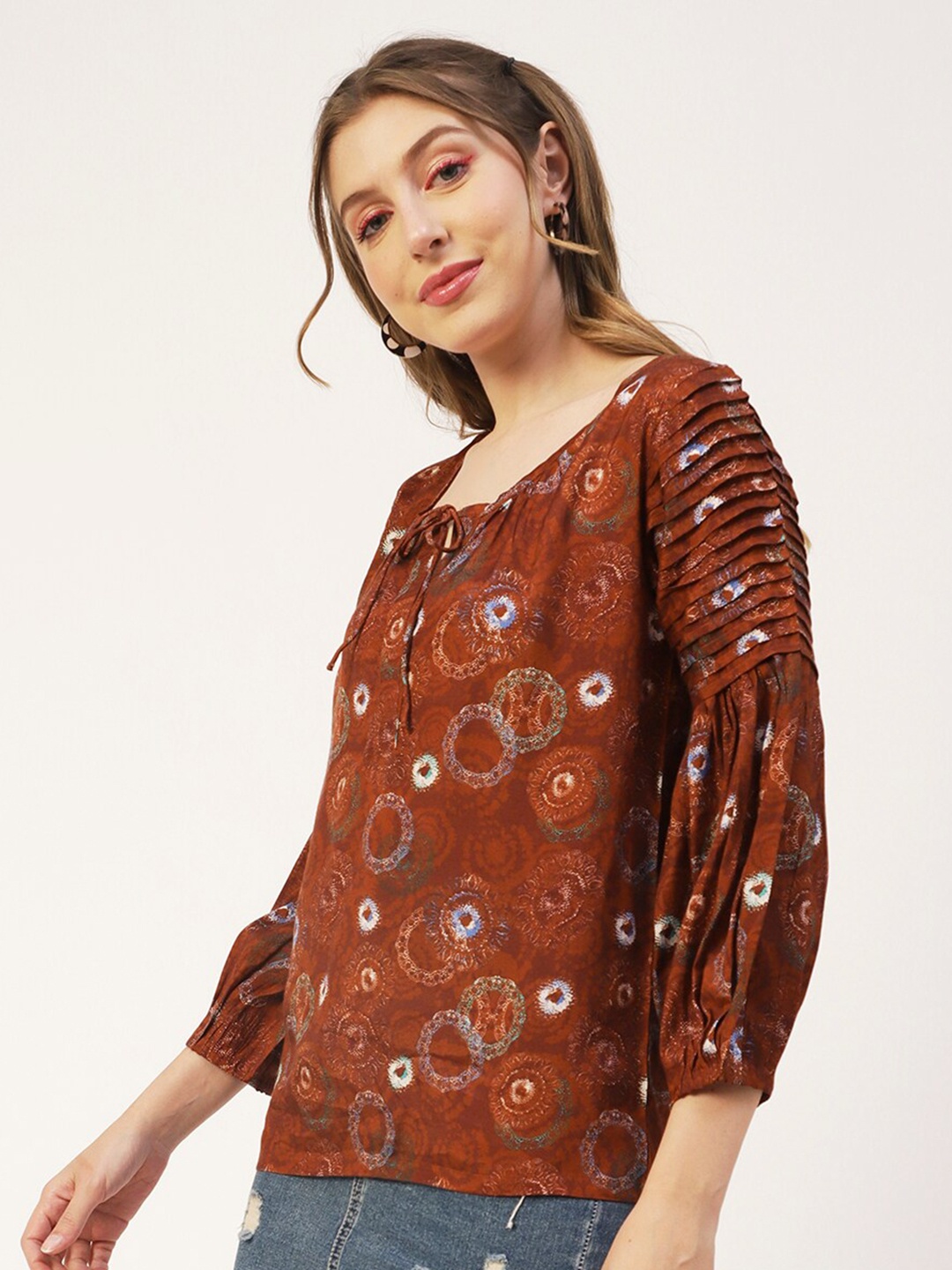 

Moomaya Ethnic Motifs Printed Tie Up Neck Puff Sleeves Pleated A-Line Top, Rust