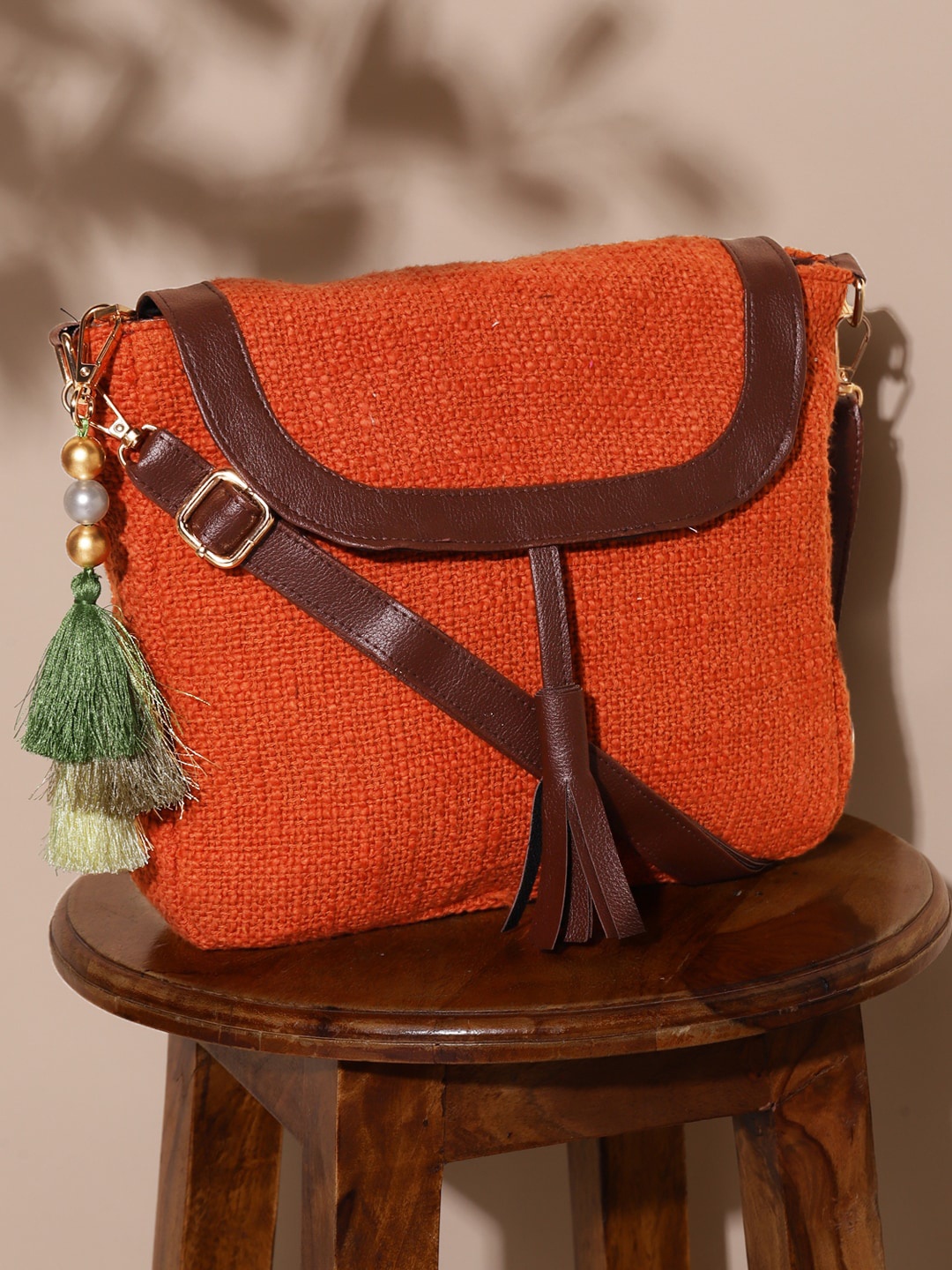 

DEEBACO Self Design Structured Sling Bag With Tasselled, Orange