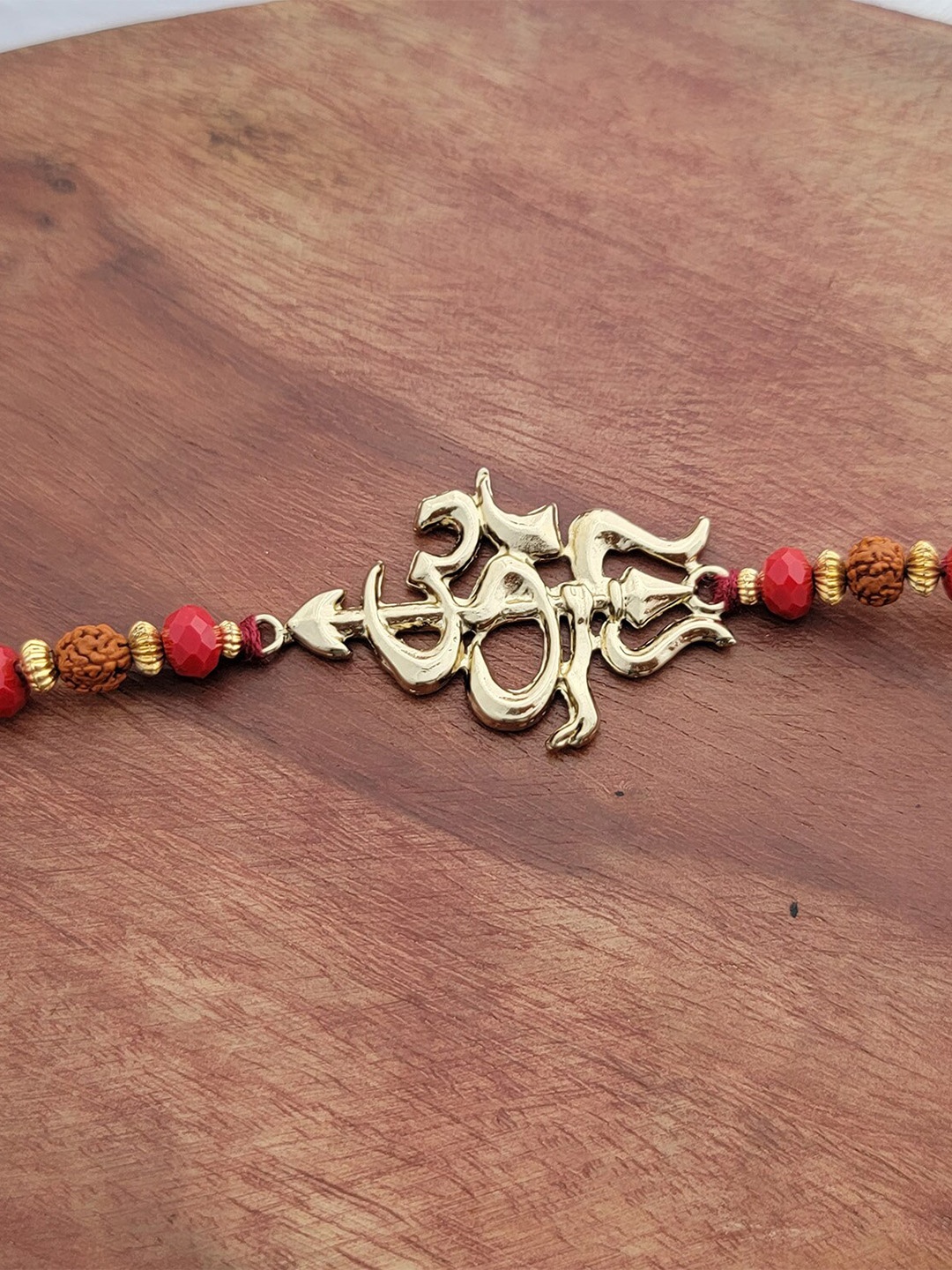 

Mahi Om and Trishul Charm Rakhi, Brown