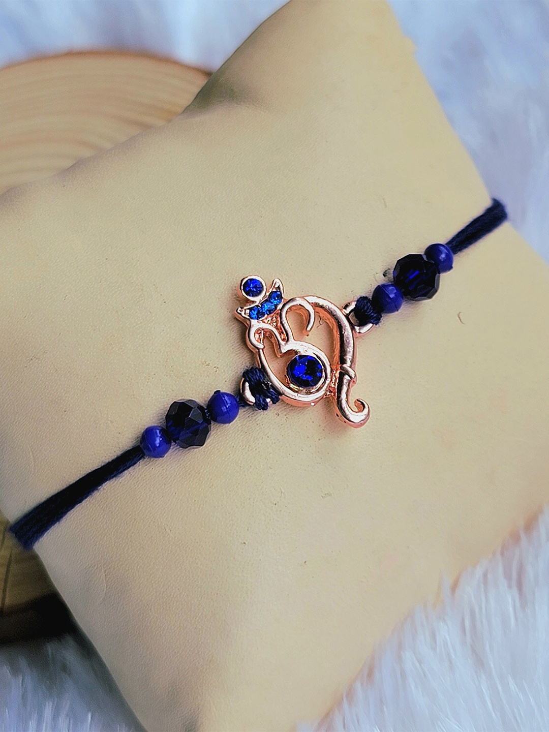 

Mahi Om & Ganpati Motif With Beaded Thread Rakhi, Blue