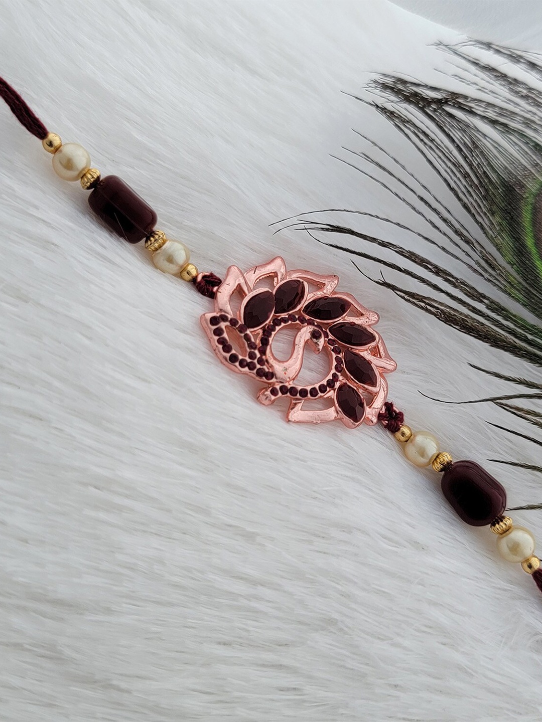 

Mahi Peacock Charm & Beaded Rakhi, Maroon