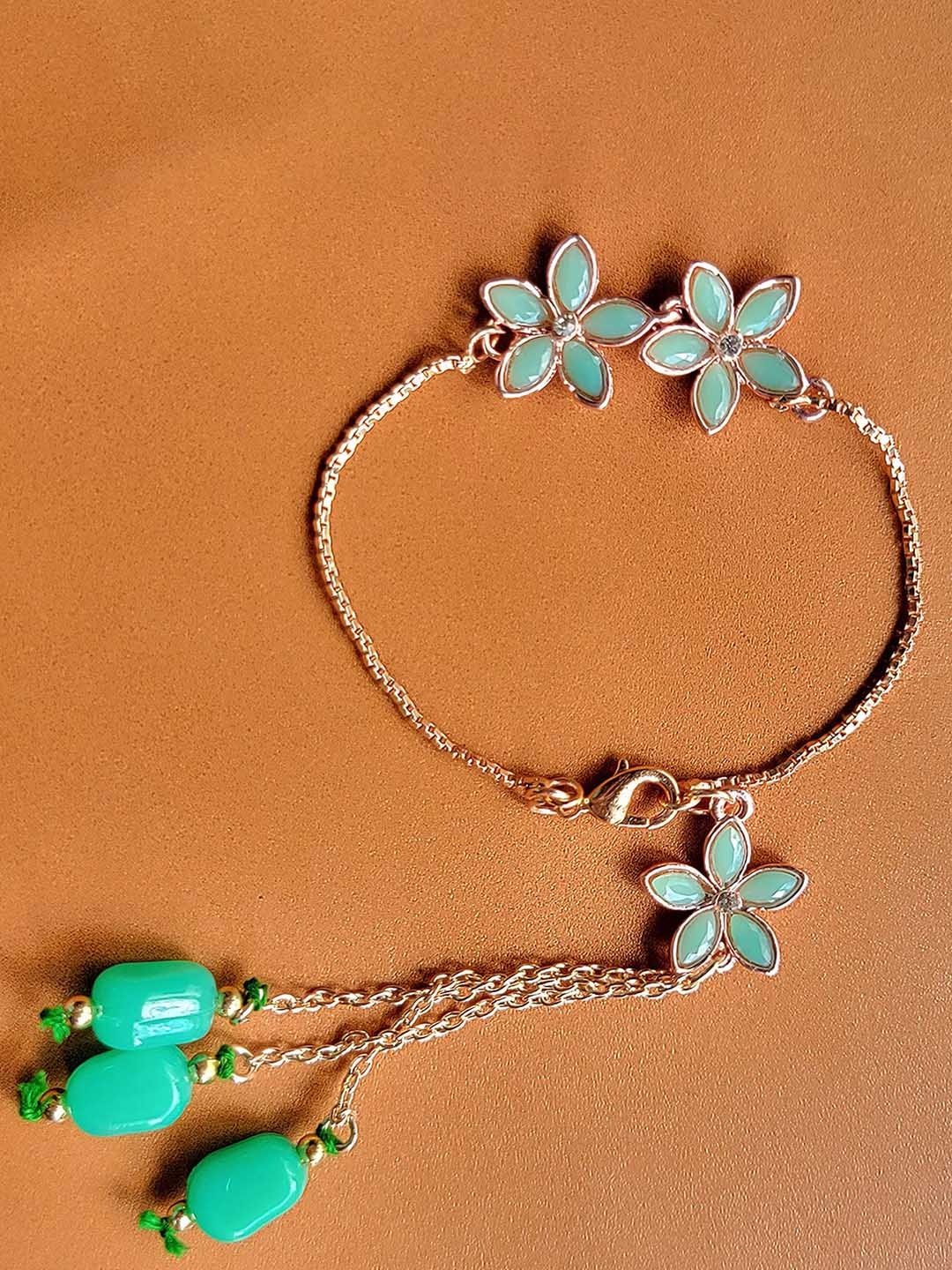 

Mahi Floral Lumba Rakhi, Gold