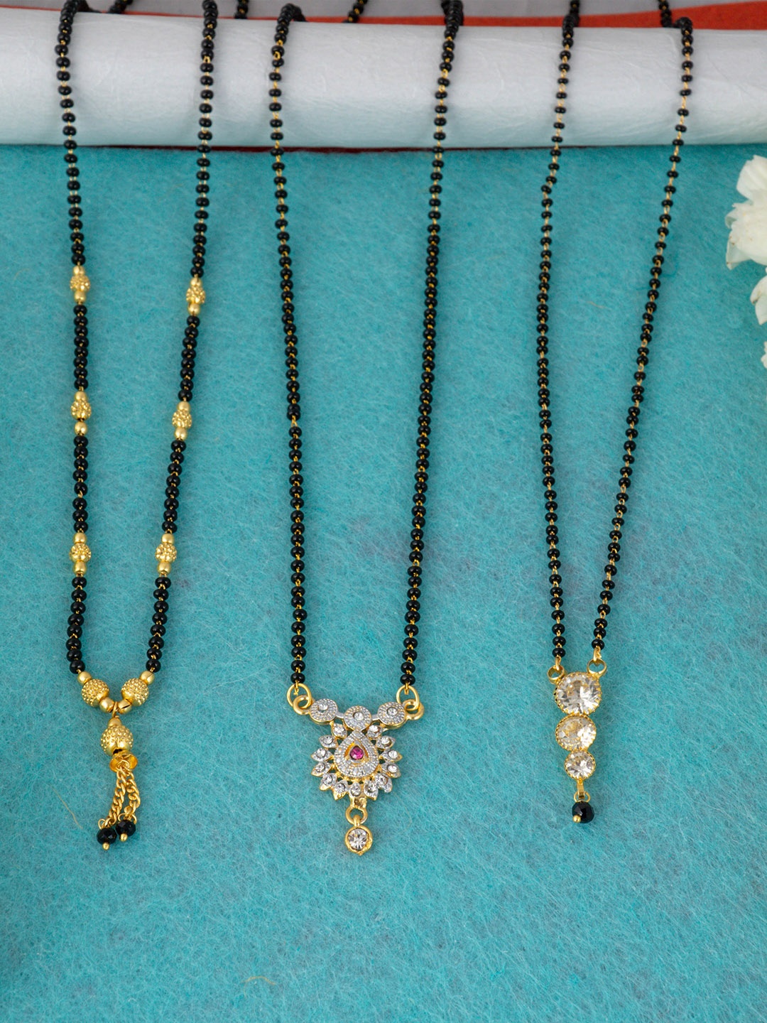 

Ramdev Art Fashion Jewellery Pack of 3 Gold-Plated White Stone-Studded Beaded Mangalsutras