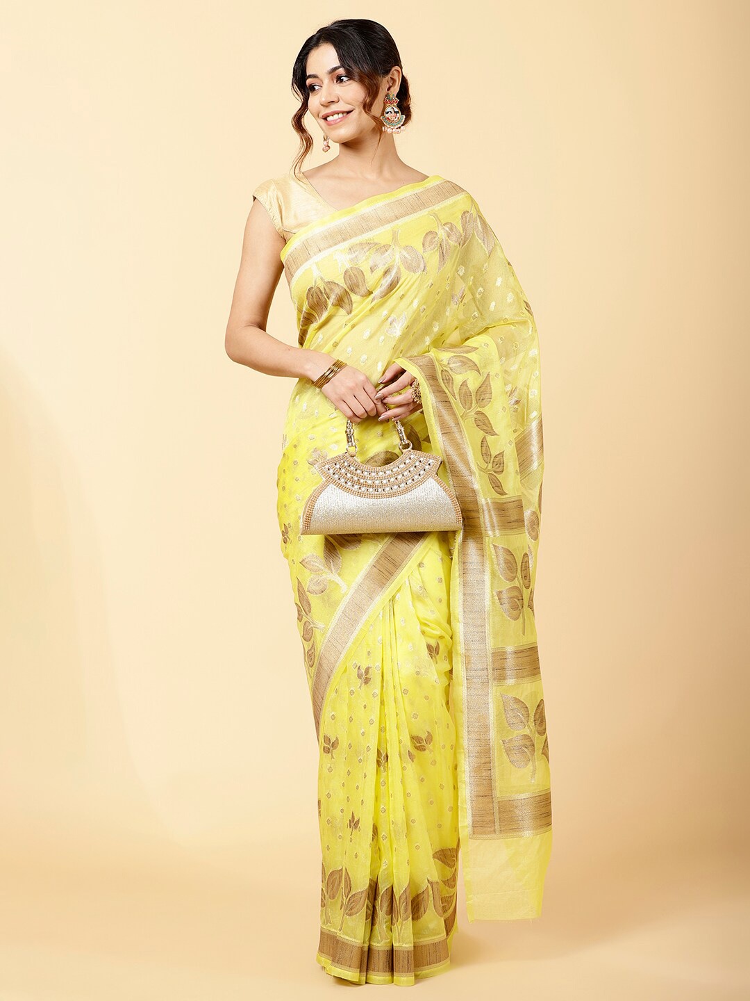 

Meena Bazaar Yellow & Gold-Toned Woven Design Organza Saree