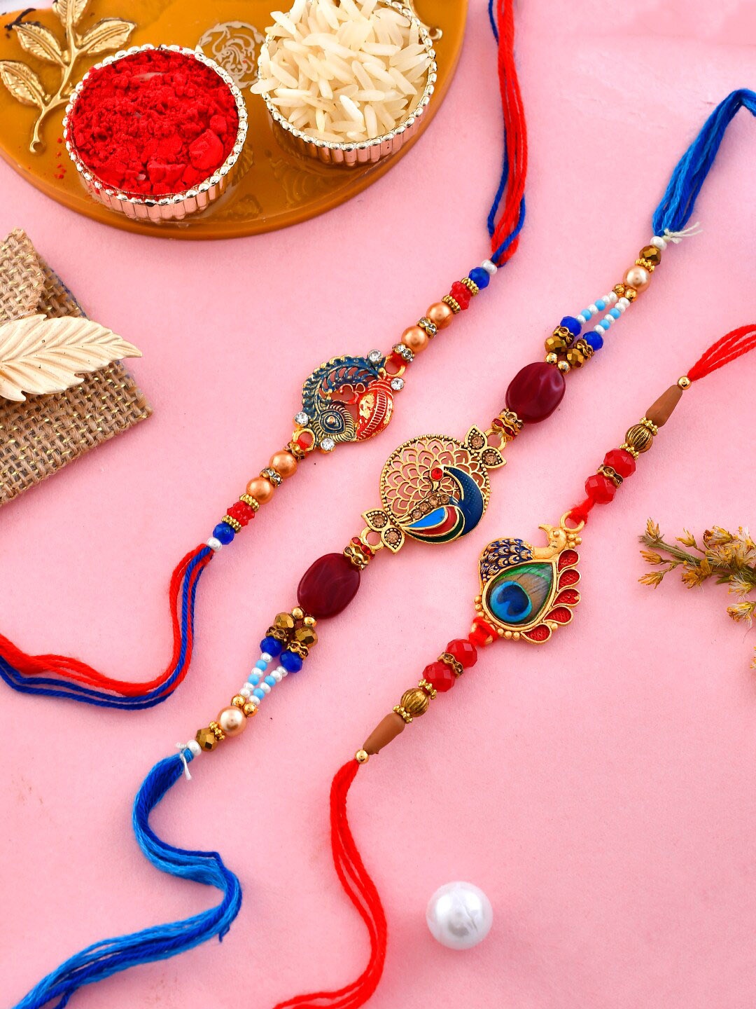 

Aapno Rajasthan Set Of 3 Elegant Cotton Thread Charm Tie-Up Rakhis, Red