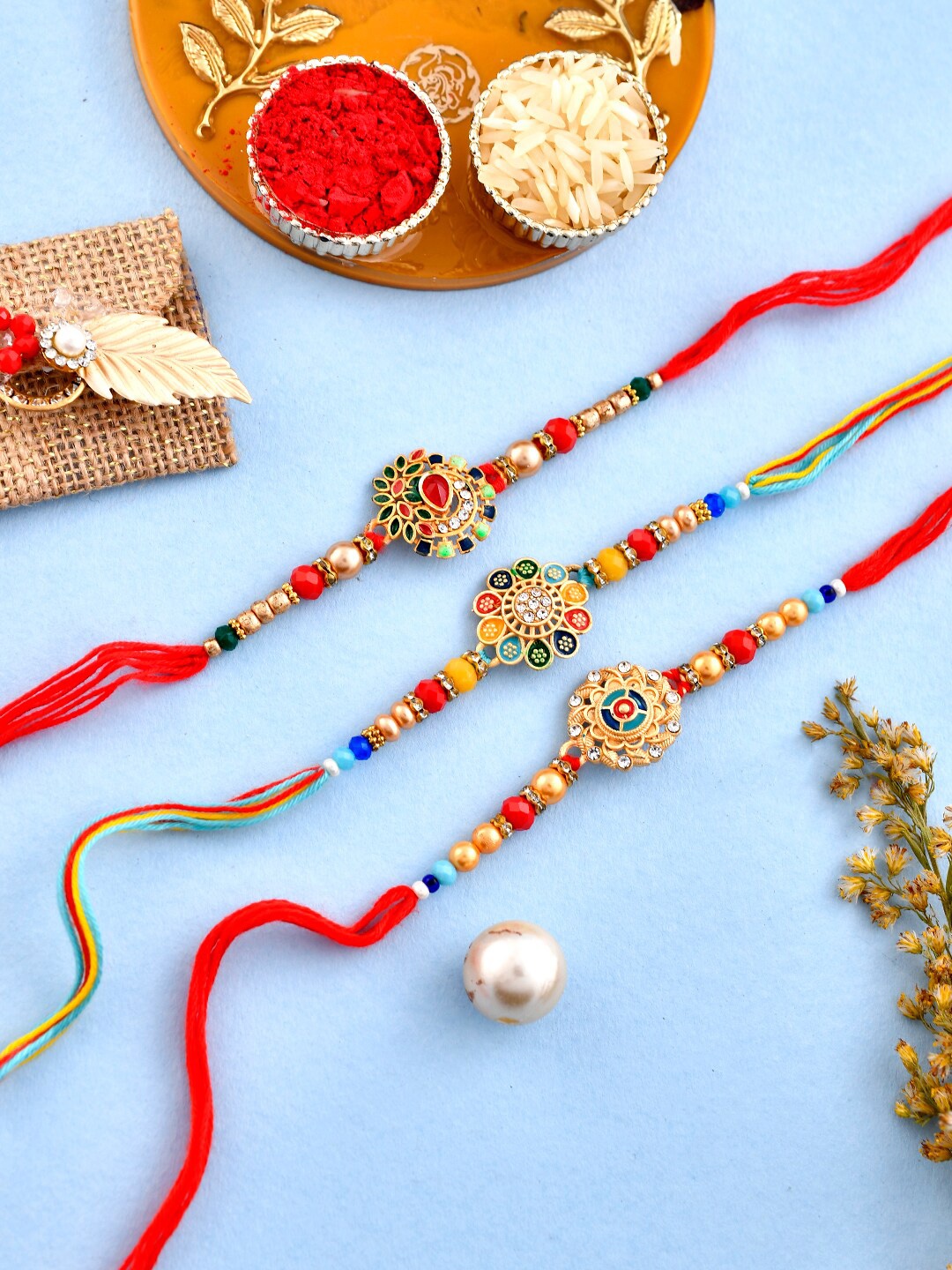 

Aapno Rajasthan Unisex Set Of 3 Kundan Studded & Beaded Rakhis With Roli Rice & Greeting, Gold