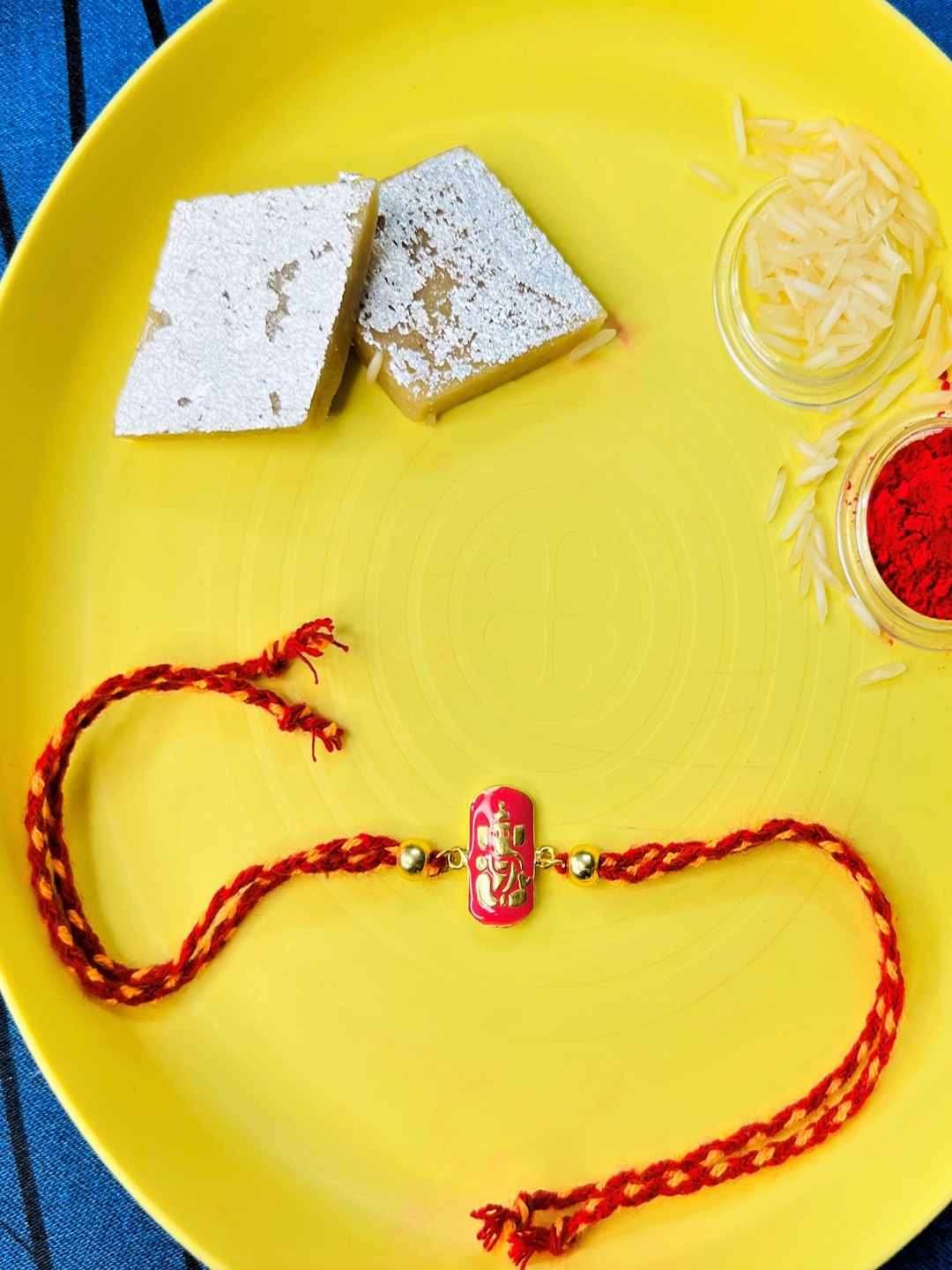

Arte Jewels Ganesha Charm Thread Rakhi With Roli & Rice, Red