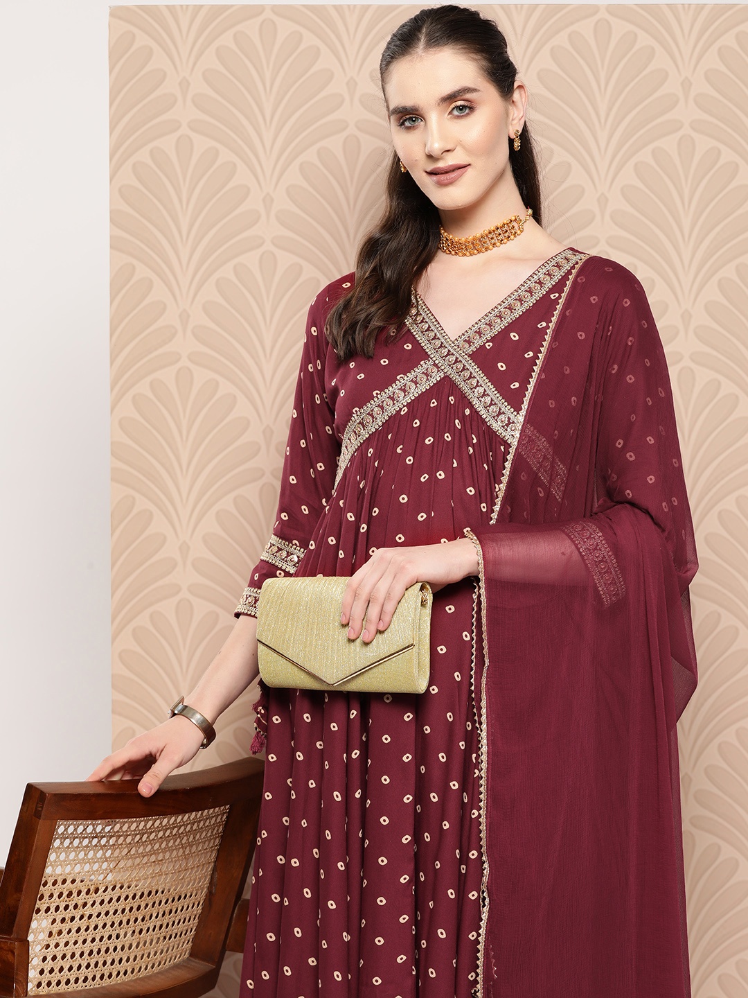 

Indo Era Women Bandhani Printed Angrakha Thread Work Kurta with Trousers & With Dupatta, Maroon