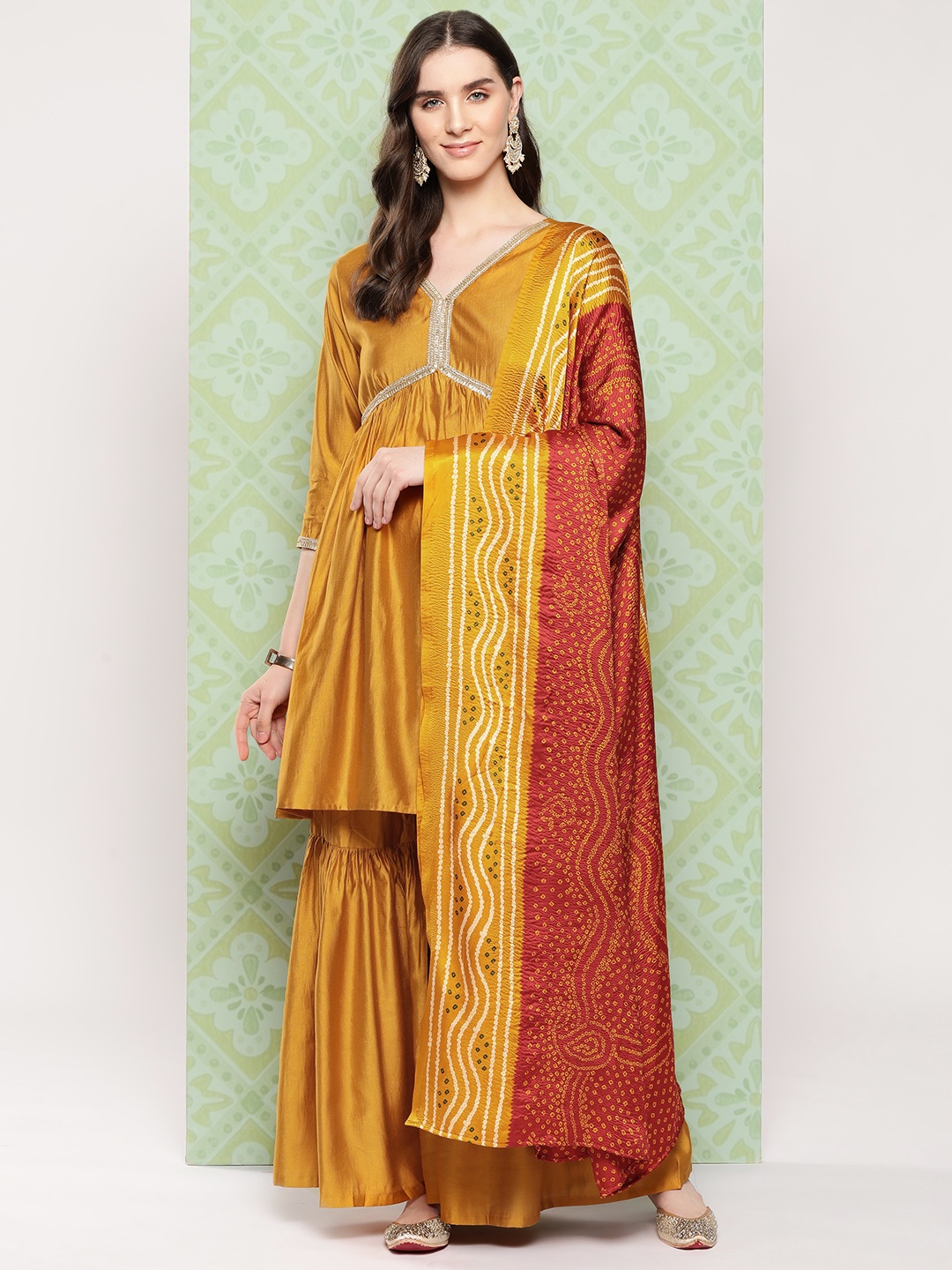

Indo Era Women Pleated Kurta with Sharara & With Dupatta, Mustard