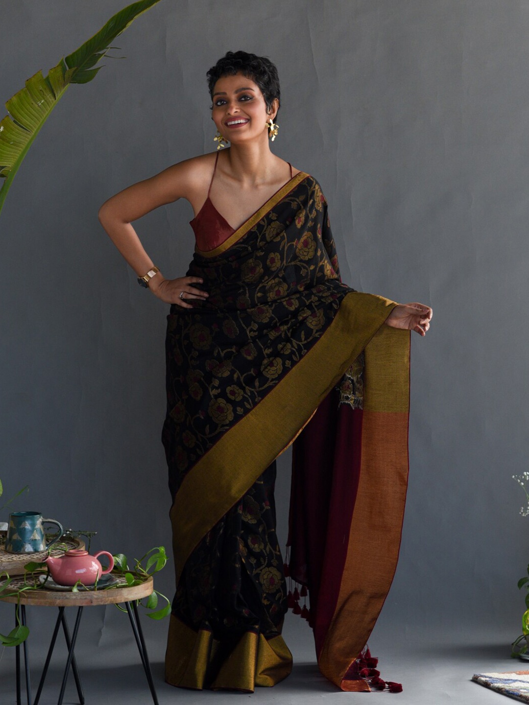 

Suta Black & Maroon Floral Printed Zari Saree