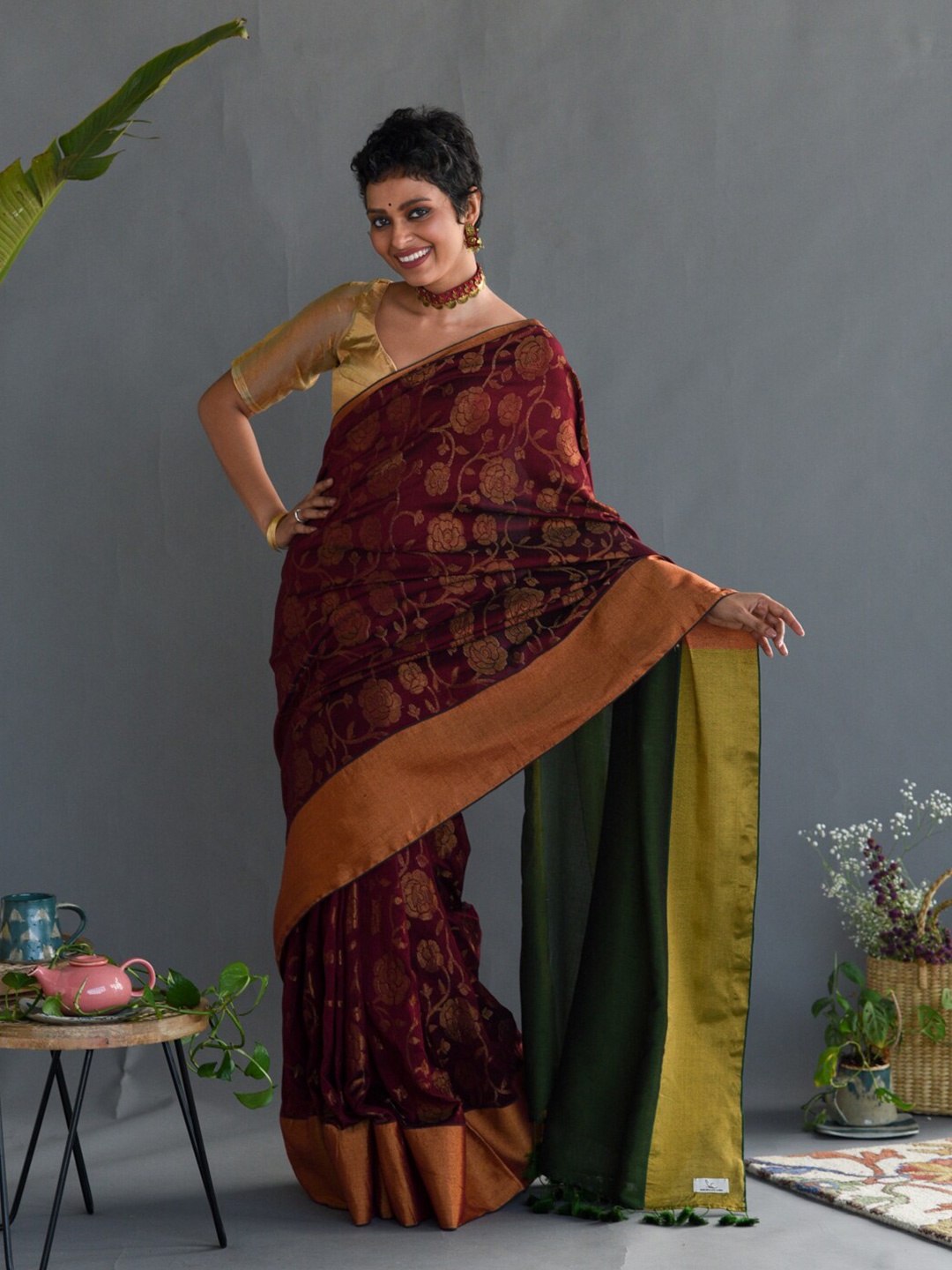 

Suta Maroon & Green Floral Printed Zari Saree