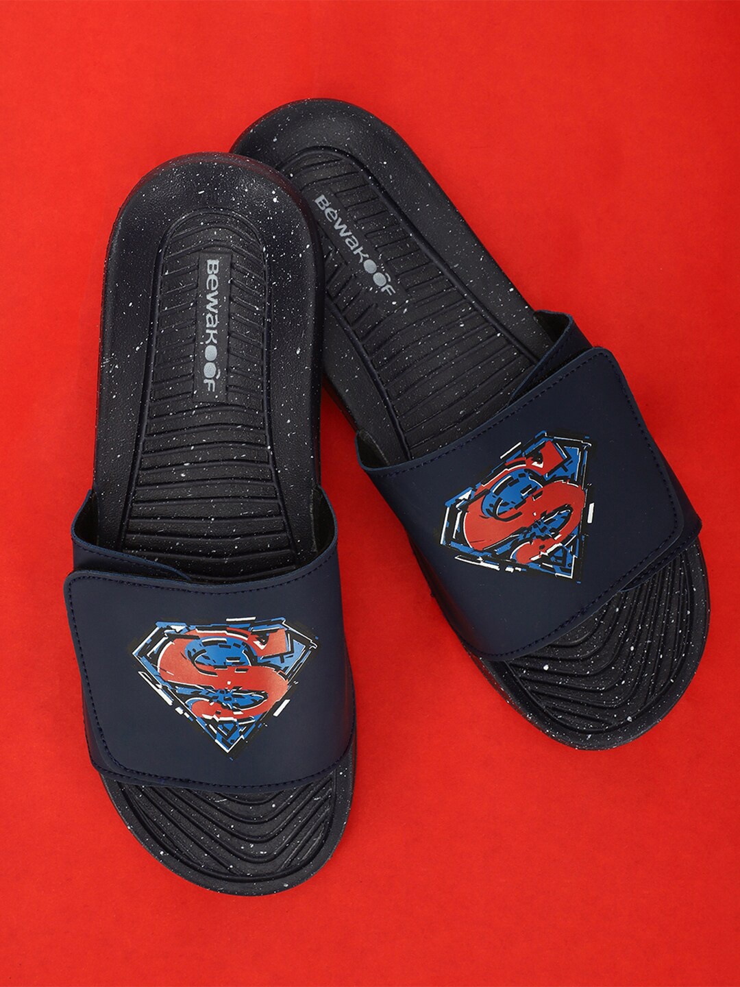 

Bewakoof Men Navy Blue & Red Superman Printed Rubber Sliders