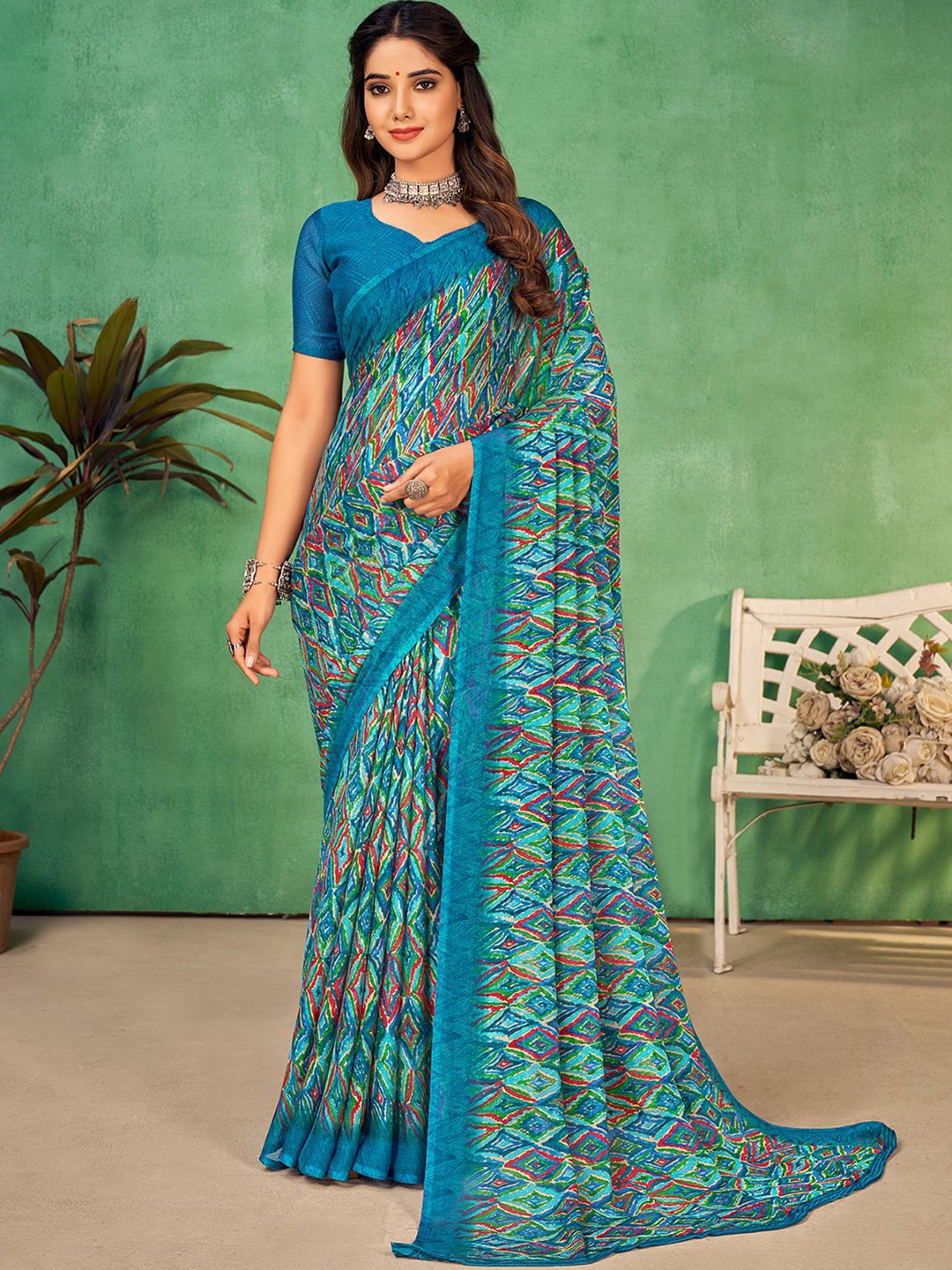 

Mitera Teal Blue Geometric Printed Poly Chiffon Saree
