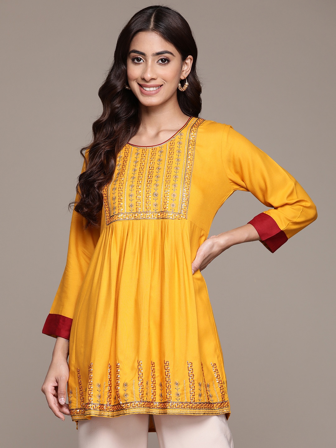 

Anubhutee Ethnic Motifs Embroidered Sequinned Pleated Kurti, Mustard