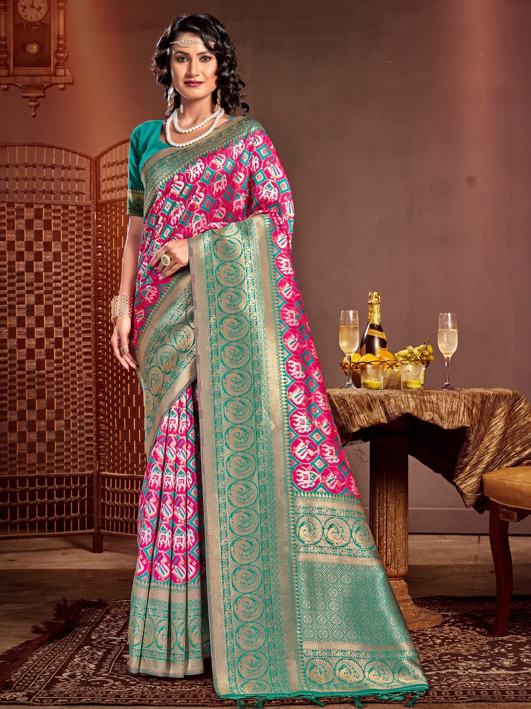

Mitera Pink & Green Ethnic Motifs Printed Zari Pure Silk Patola Saree